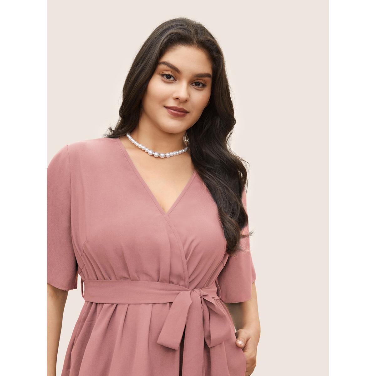 Plus Size Bloom Dress - Solid Tie Surplice Ruffle High Low Dress Lightpink Women Elegant Cross straps V-neck Short sleeve Curvy Midi Dress BloomChic 22-24/3X Product Image