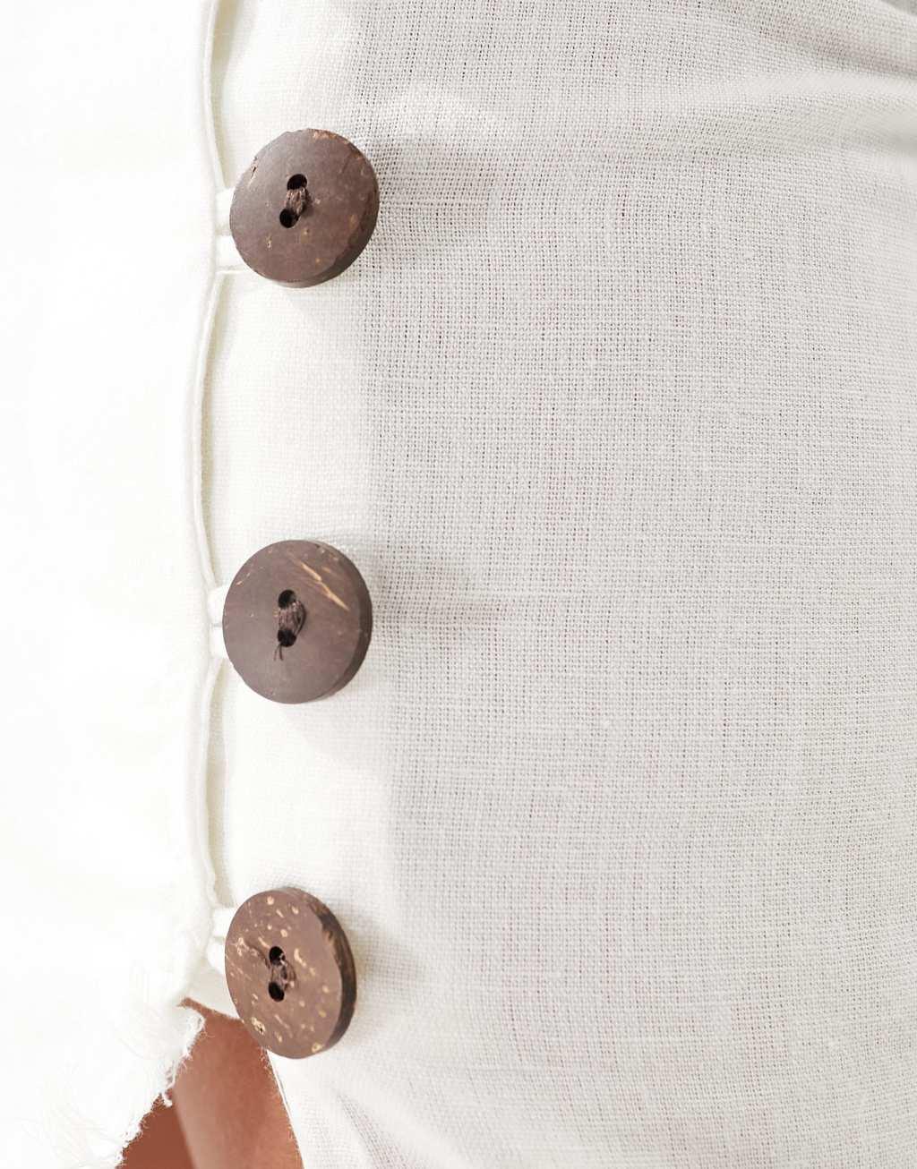ASOS DESIGN Petite linen midi skirt with raw edge and button detail in white Product Image