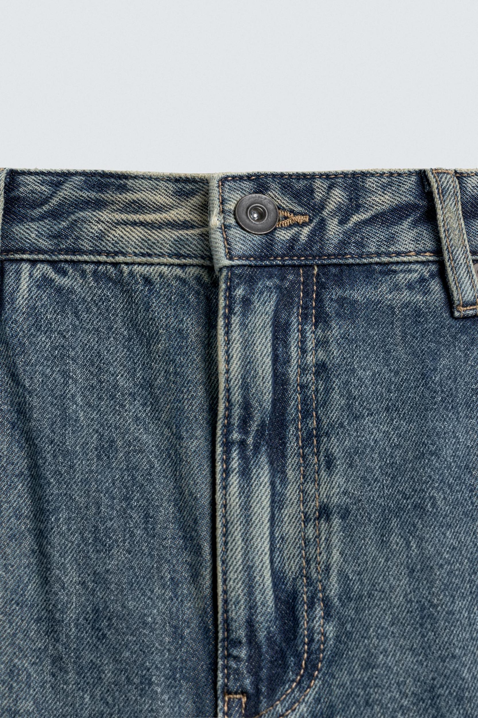 FLARE FIT STAIN WASH JEANS Product Image
