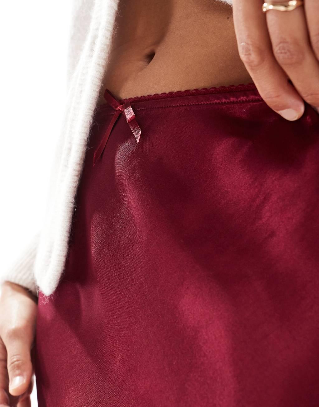 Miss Selfridge satin bias mini skirt with bow in burgundy Product Image