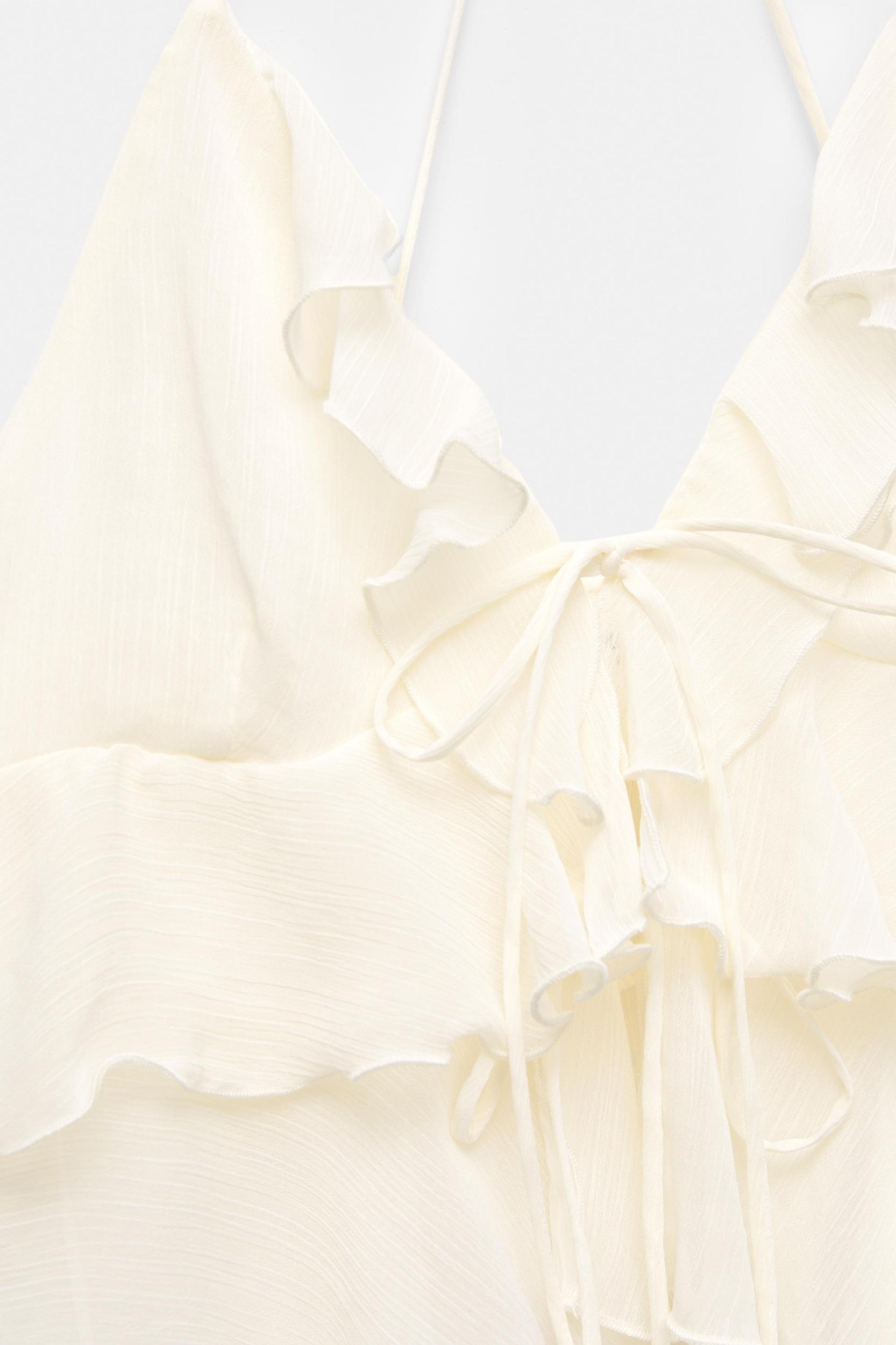 Ruffled top with bow Product Image