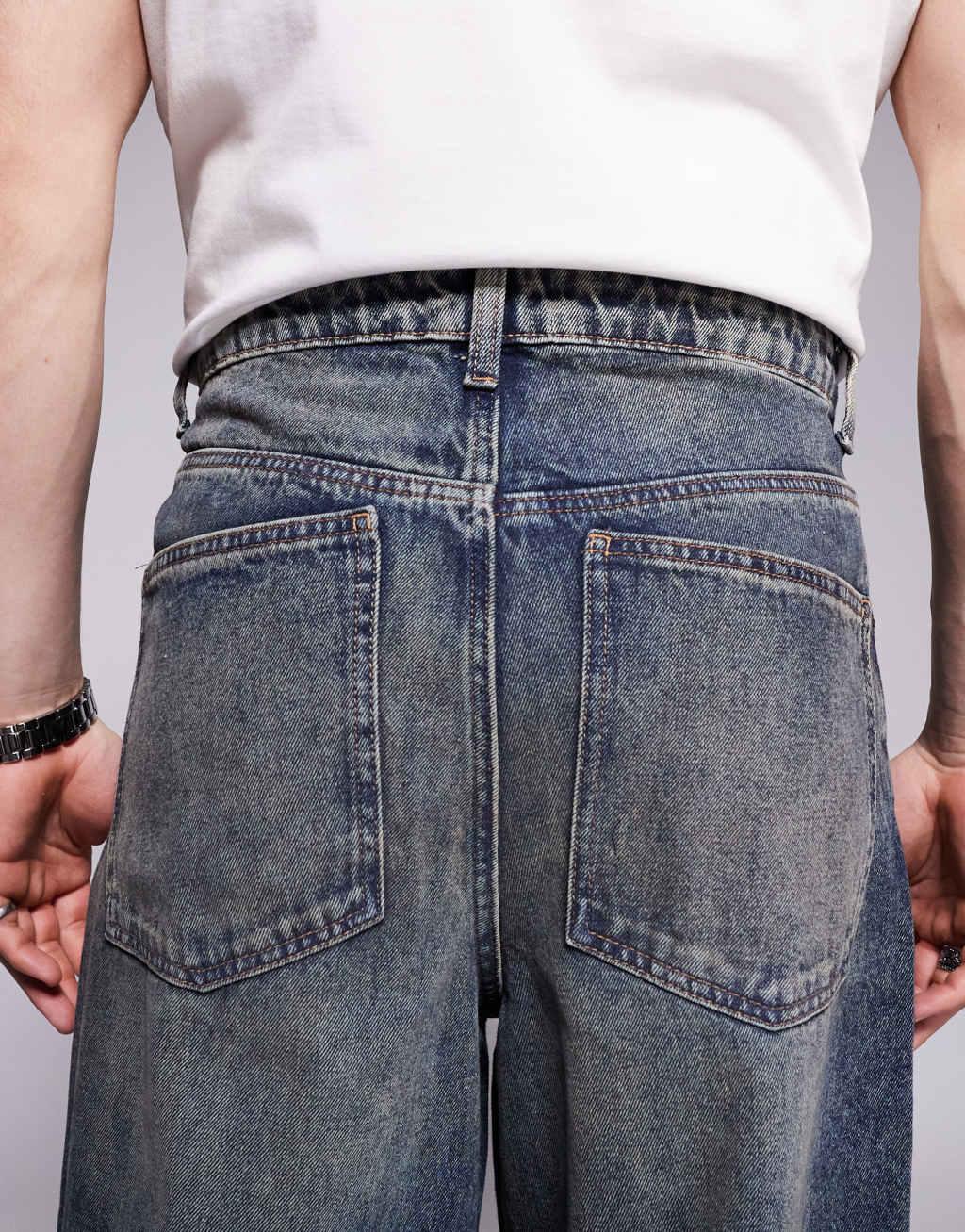ASOS DESIGN super baggy jeans in mid wash blue Product Image