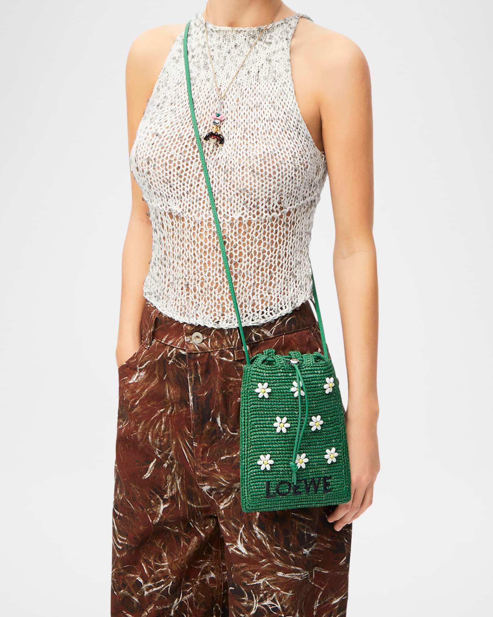 x Paula’s Ibiza Drawstring Pocket Flower Crossbody Bag in Raffia Product Image
