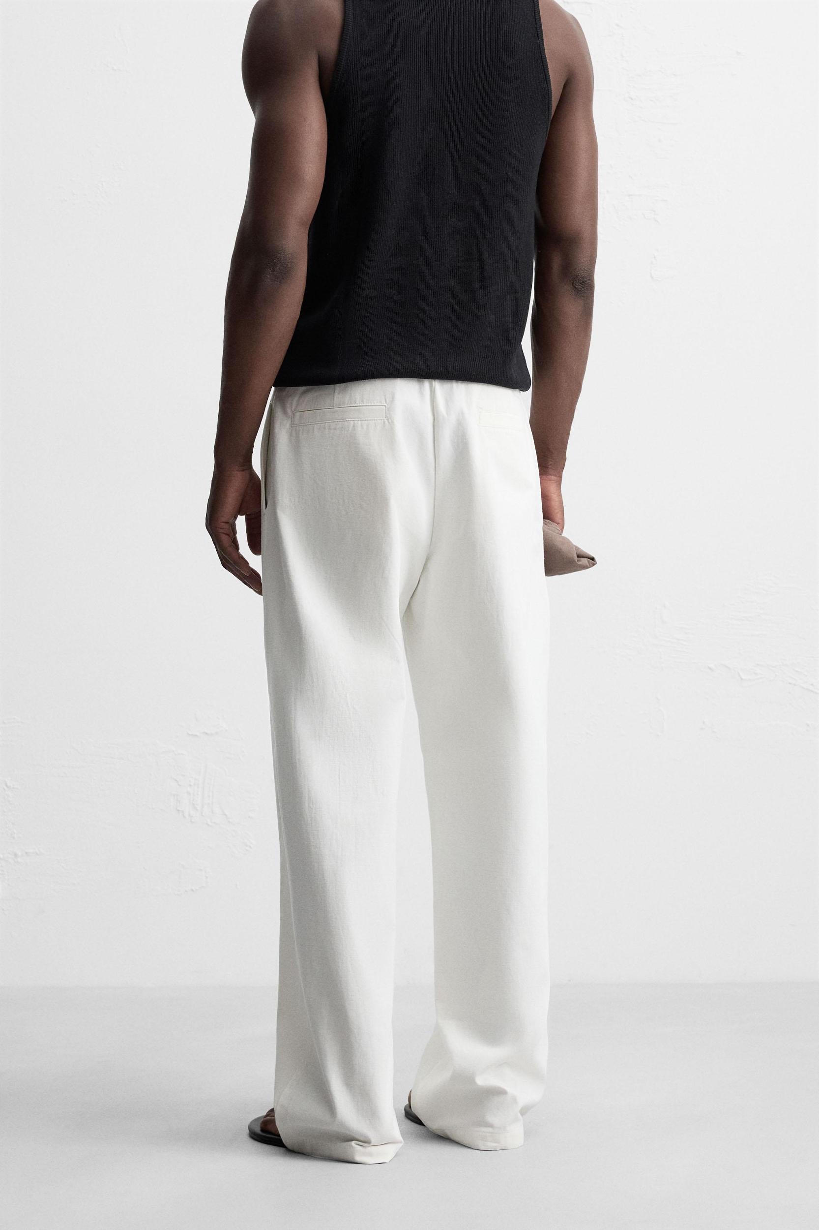 RELAXED FIT PLEATED PANTS Product Image
