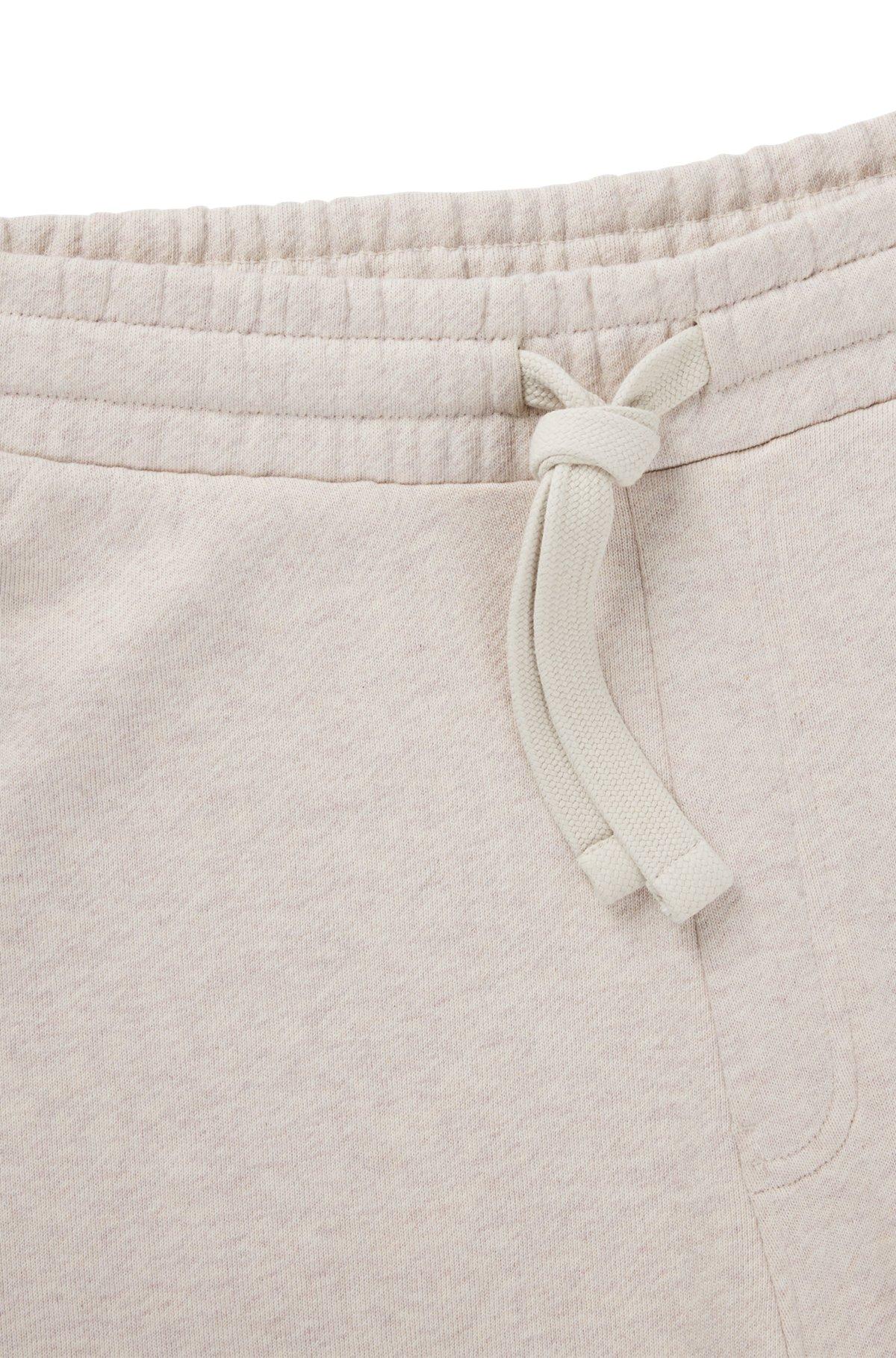 Cotton-terry tracksuit bottoms with embroidered graphics Product Image