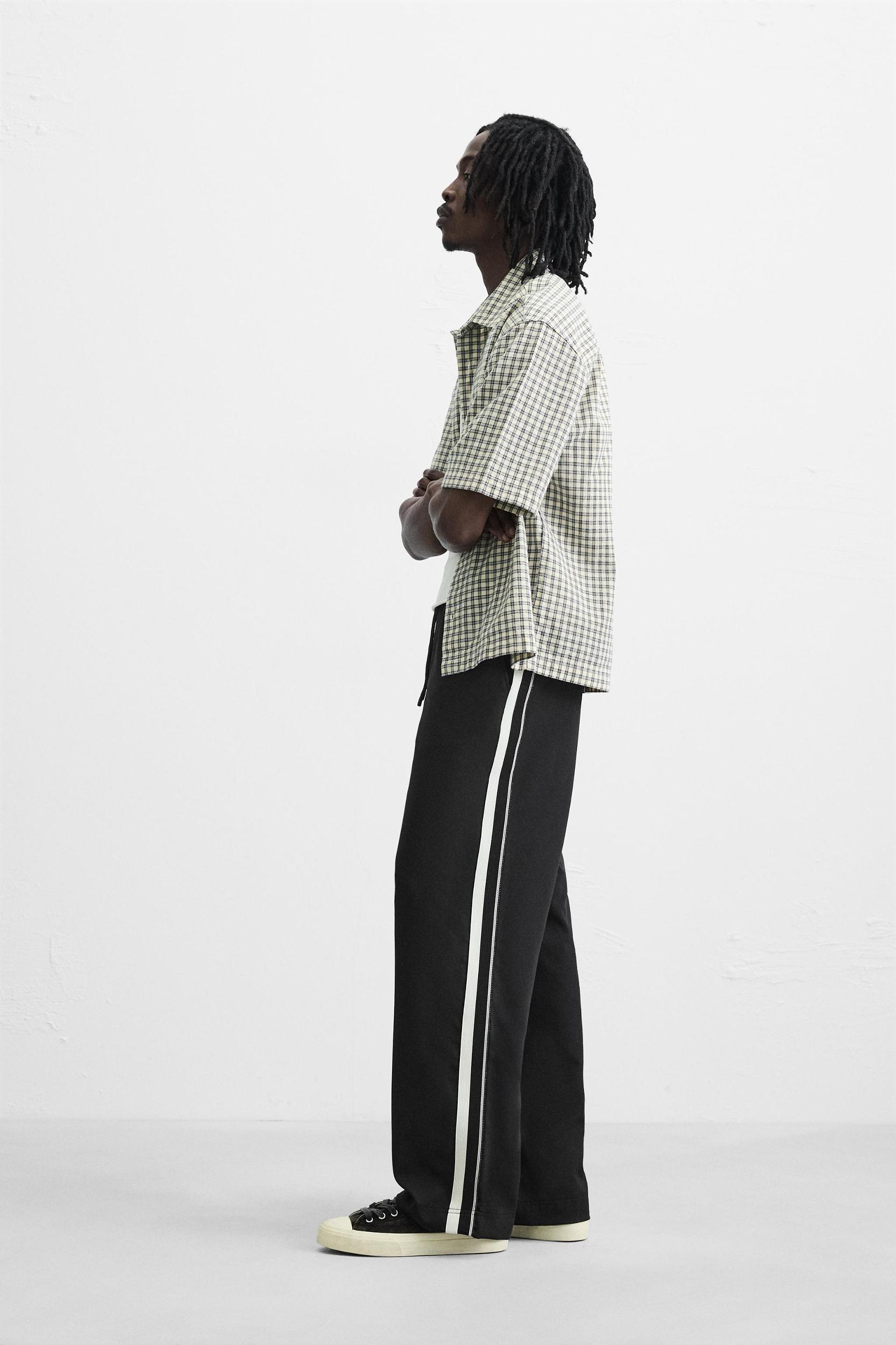 RELAXED FIT PANTS WITH CONTRASTING STRIPES Product Image