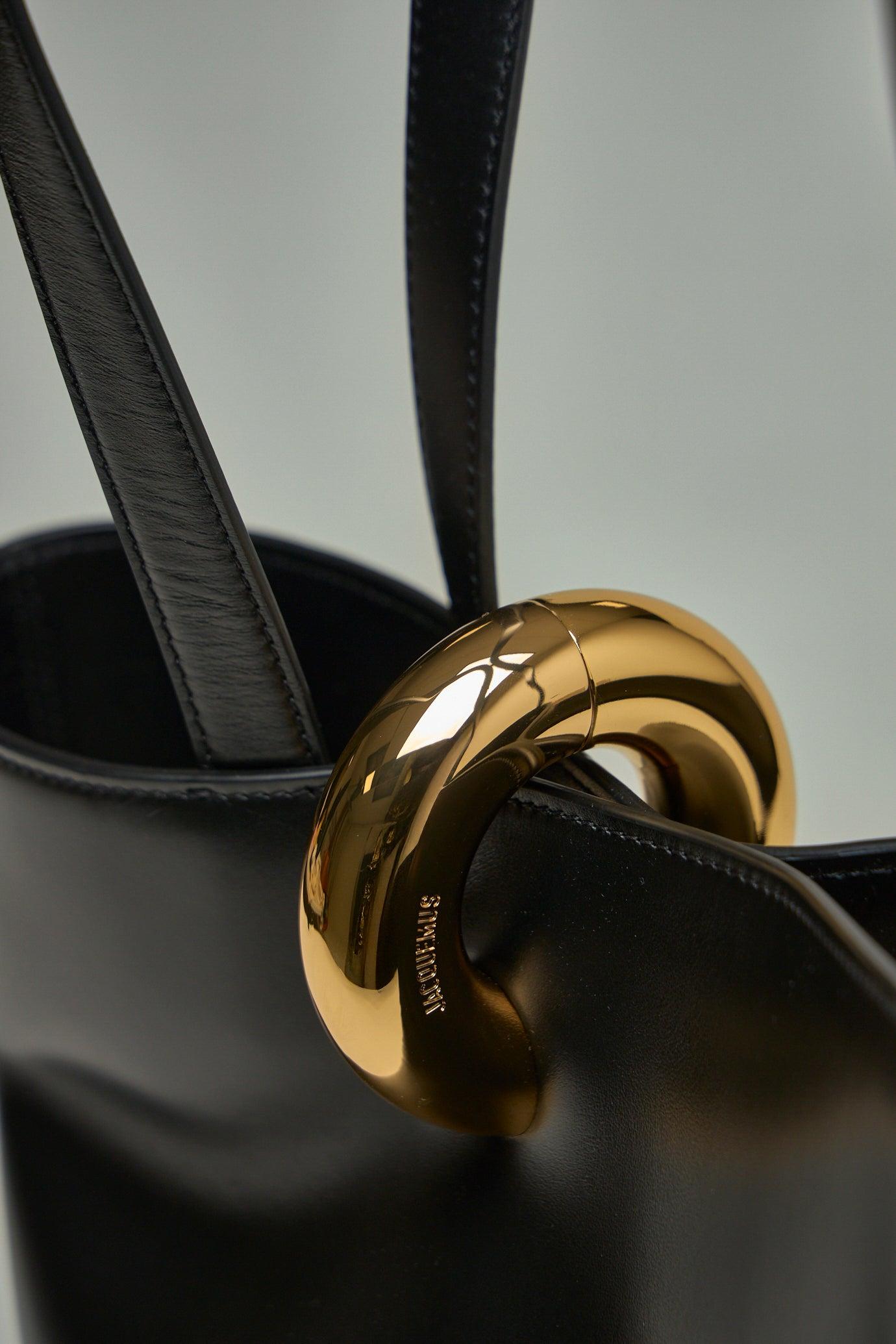 JACQUEMUS The Medium Bambola Asymmetric Leather Bucket Bag In Black 990 Product Image