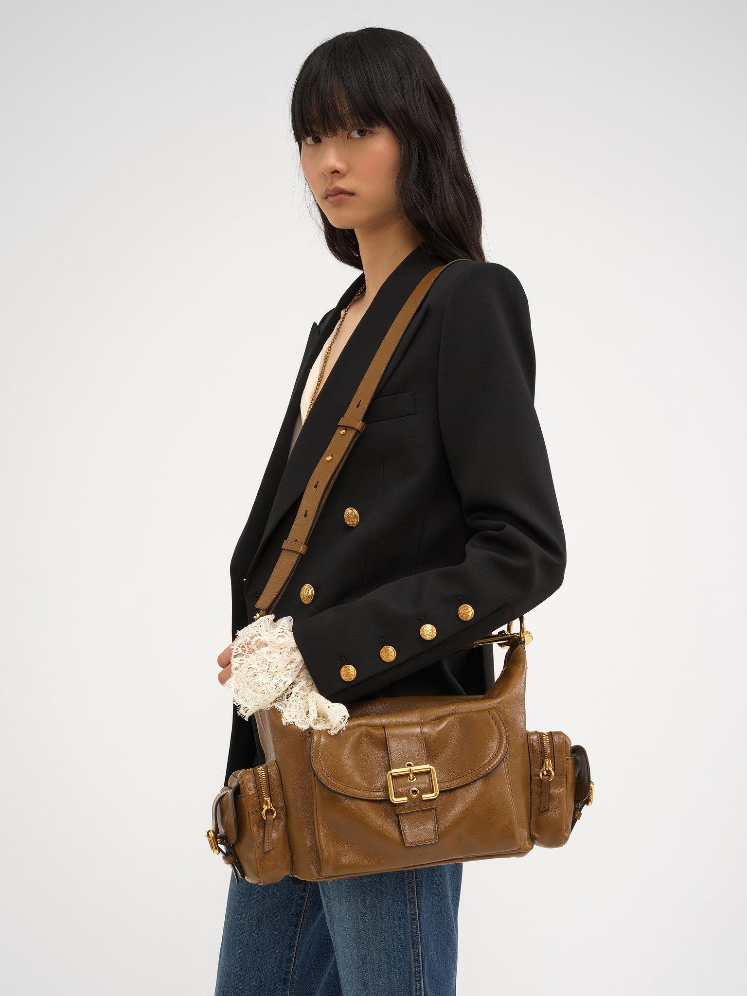 Camera bag in shiny leather Product Image