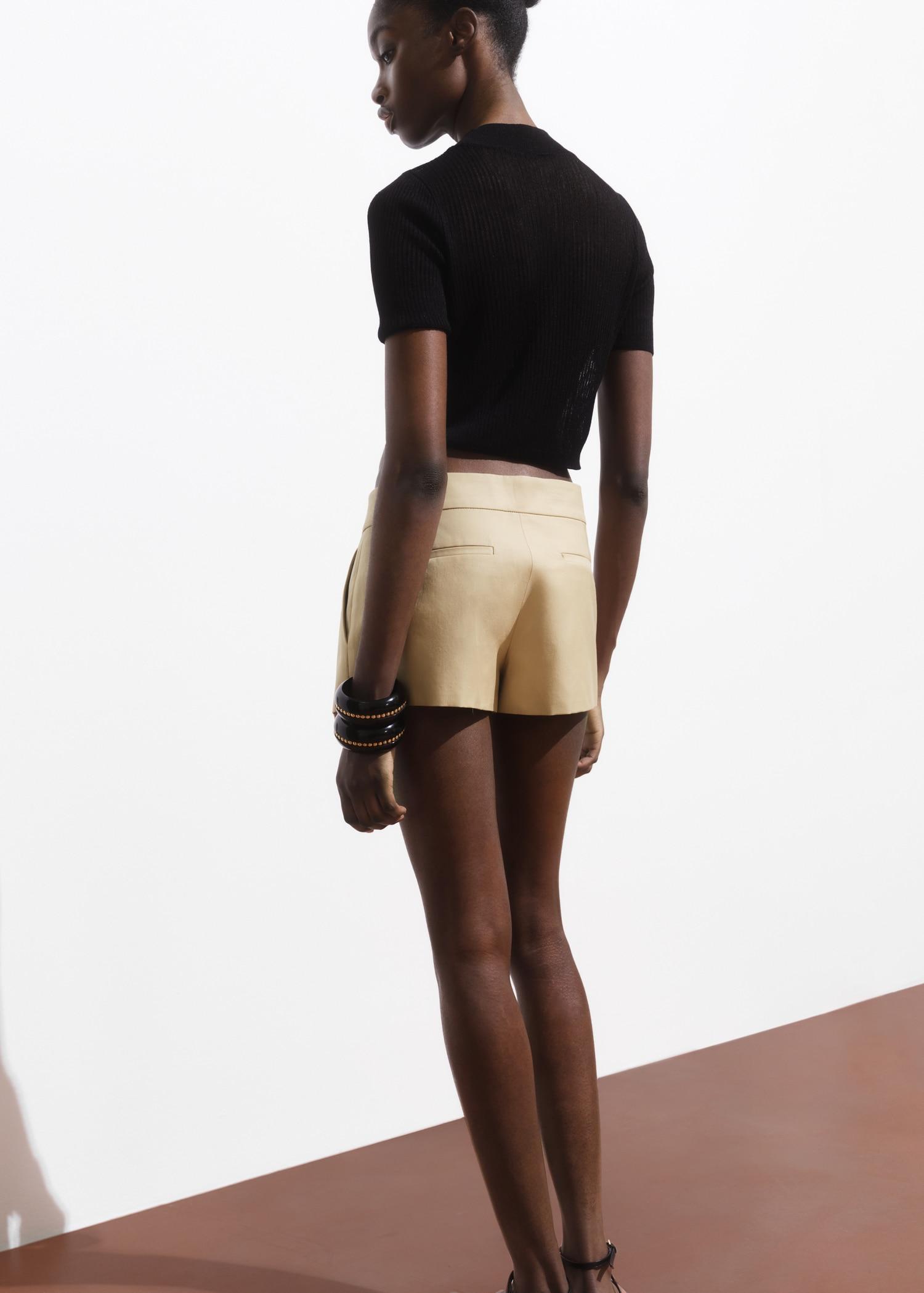 Mini-skirt with pleats - Women | MANGO USA Product Image