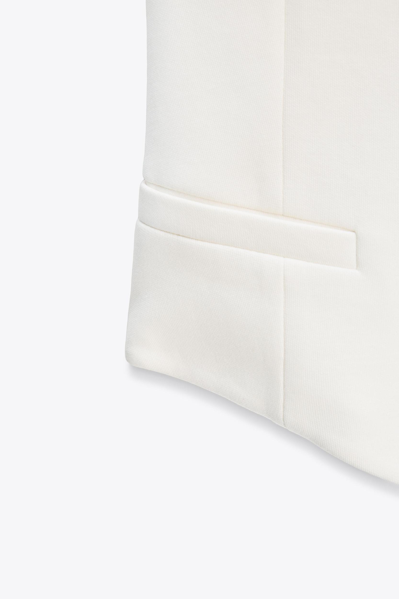 ASYMMETRIC INTERLOCK VEST TOP Product Image