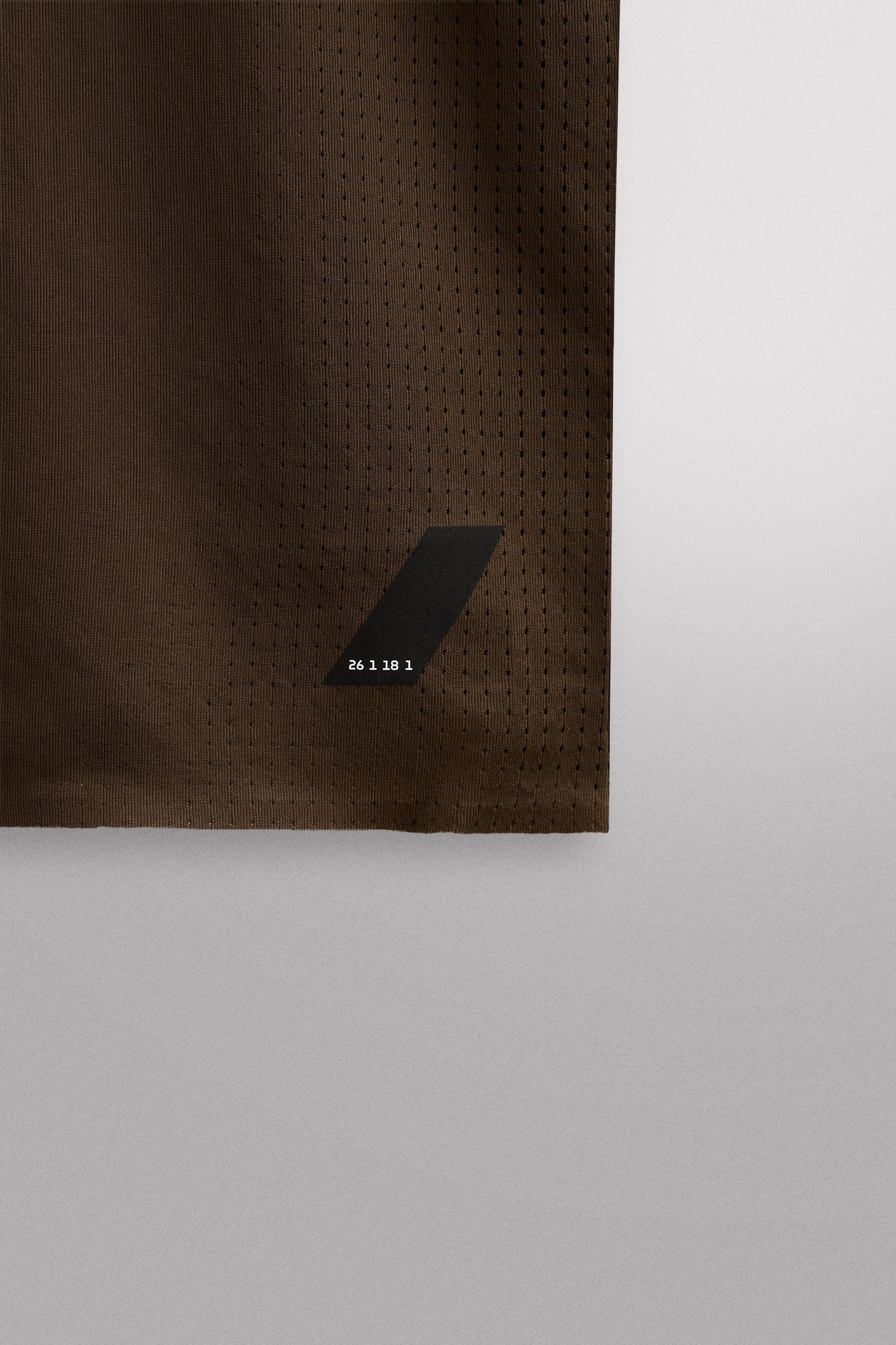 OPEN KNIT STRUCTURE T-SHIRT Product Image