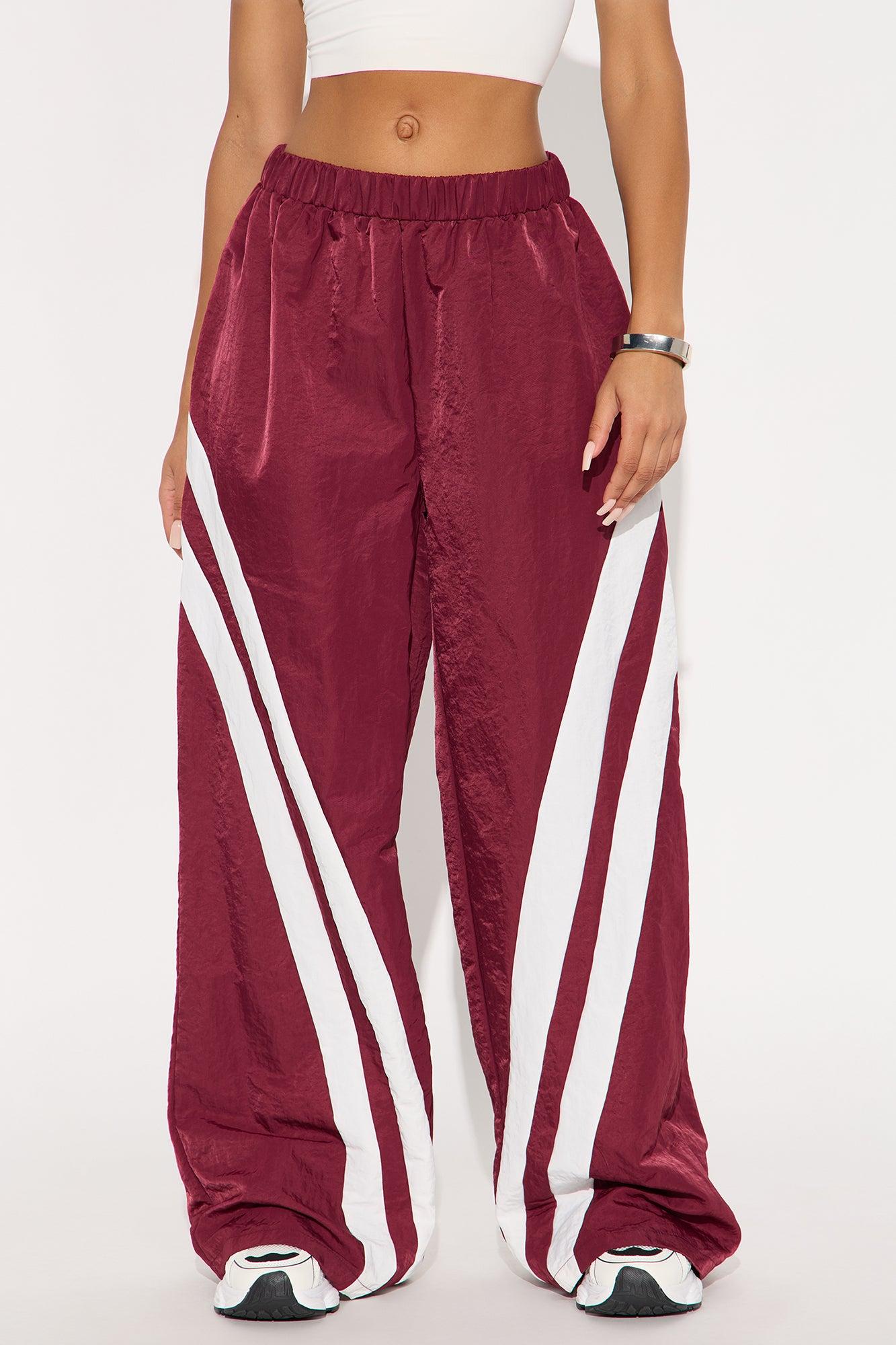 Follow The Curve Windbreaker Track Pant - Burgundy Female Product Image