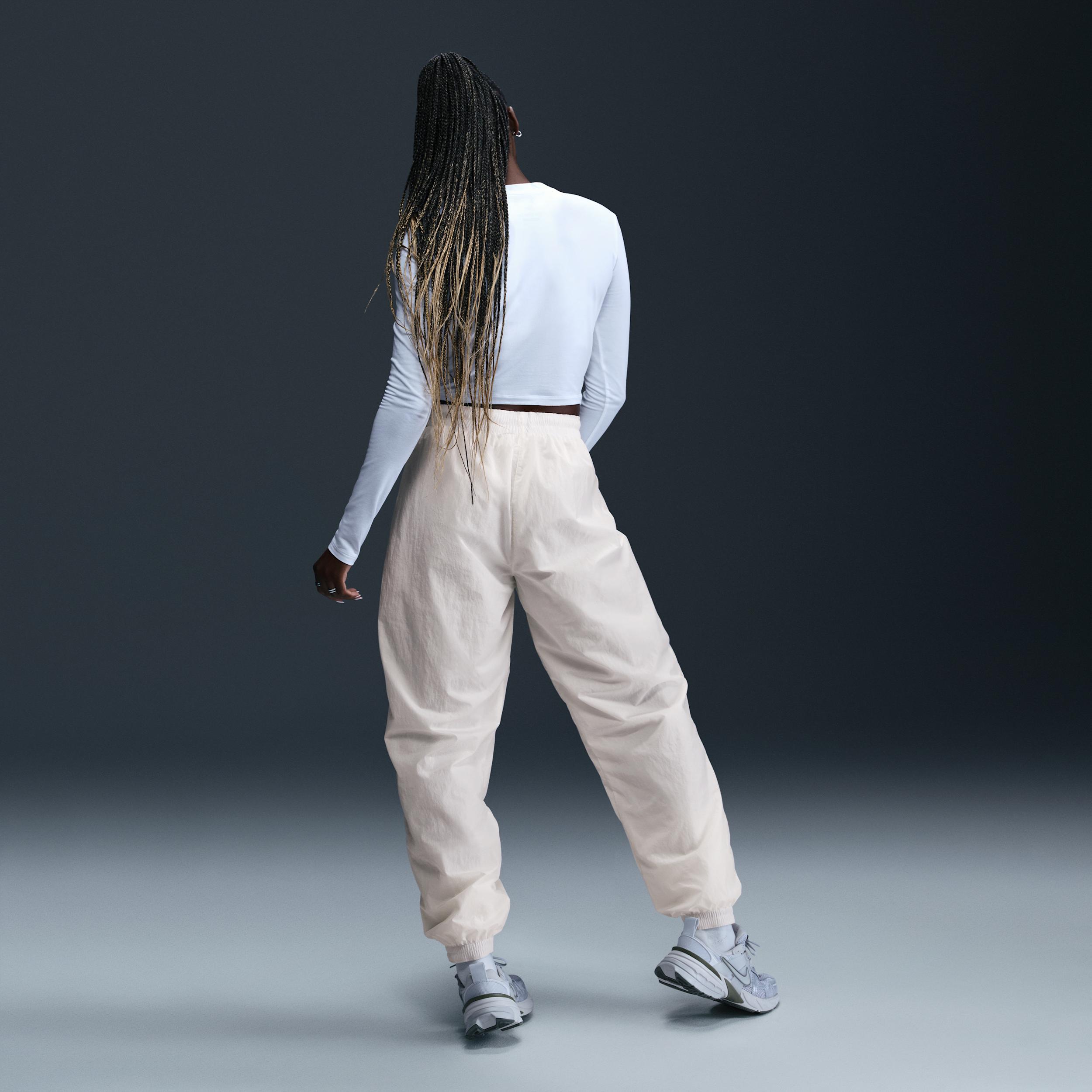 Womens Nike Sportswear Essential Mid-Rise Oversized Woven Jogger Pants | FV7668-004 Product Image