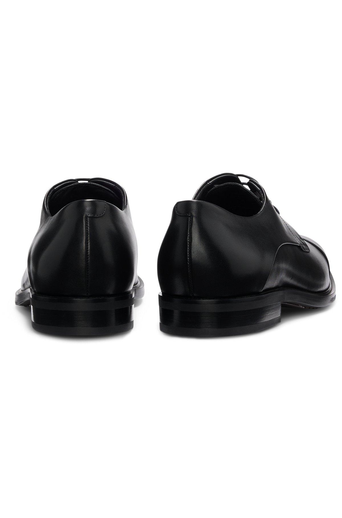 Cap-toe Derby shoes in leather Product Image