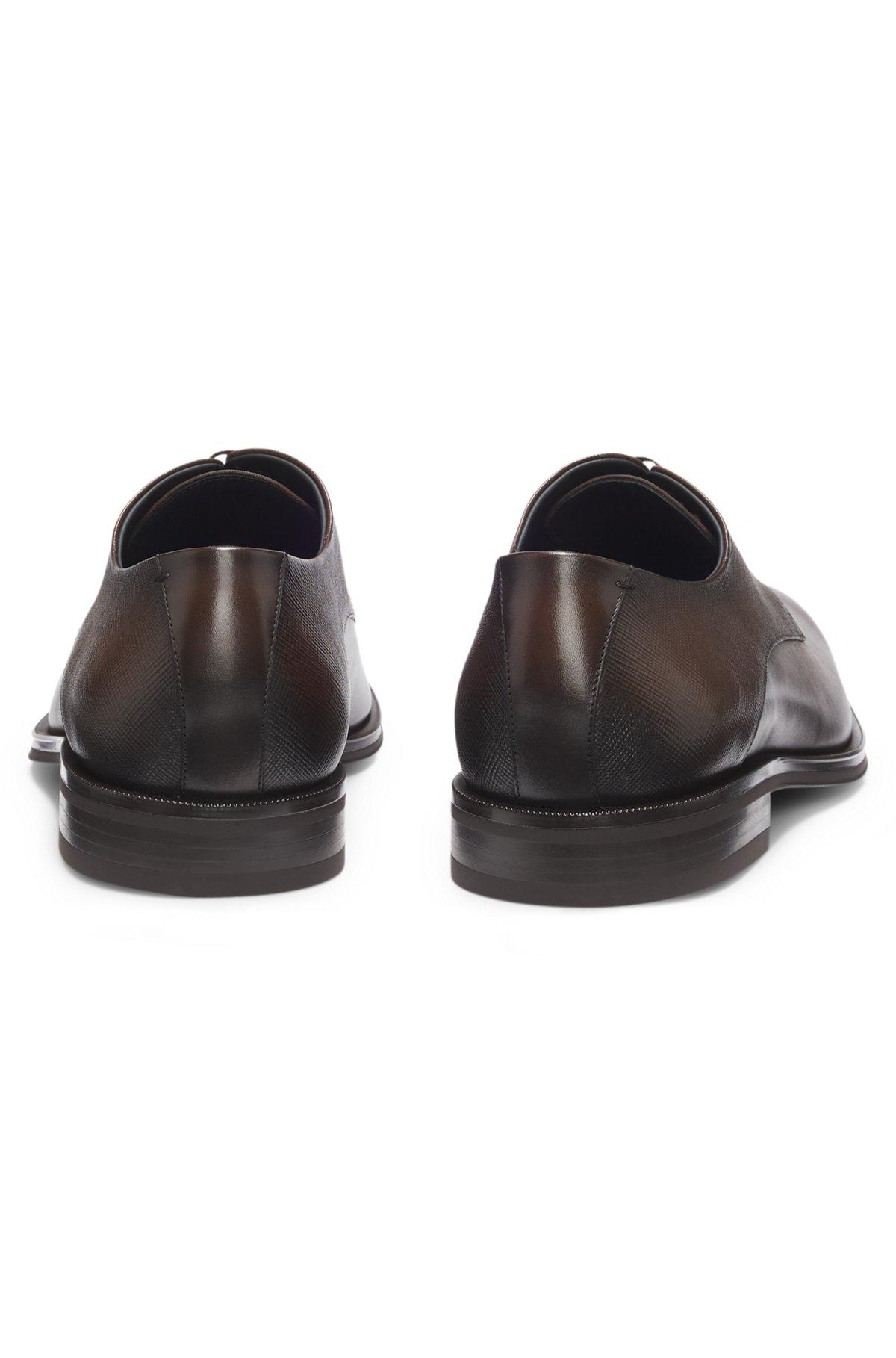 Derby shoes in textured and smooth leather Product Image