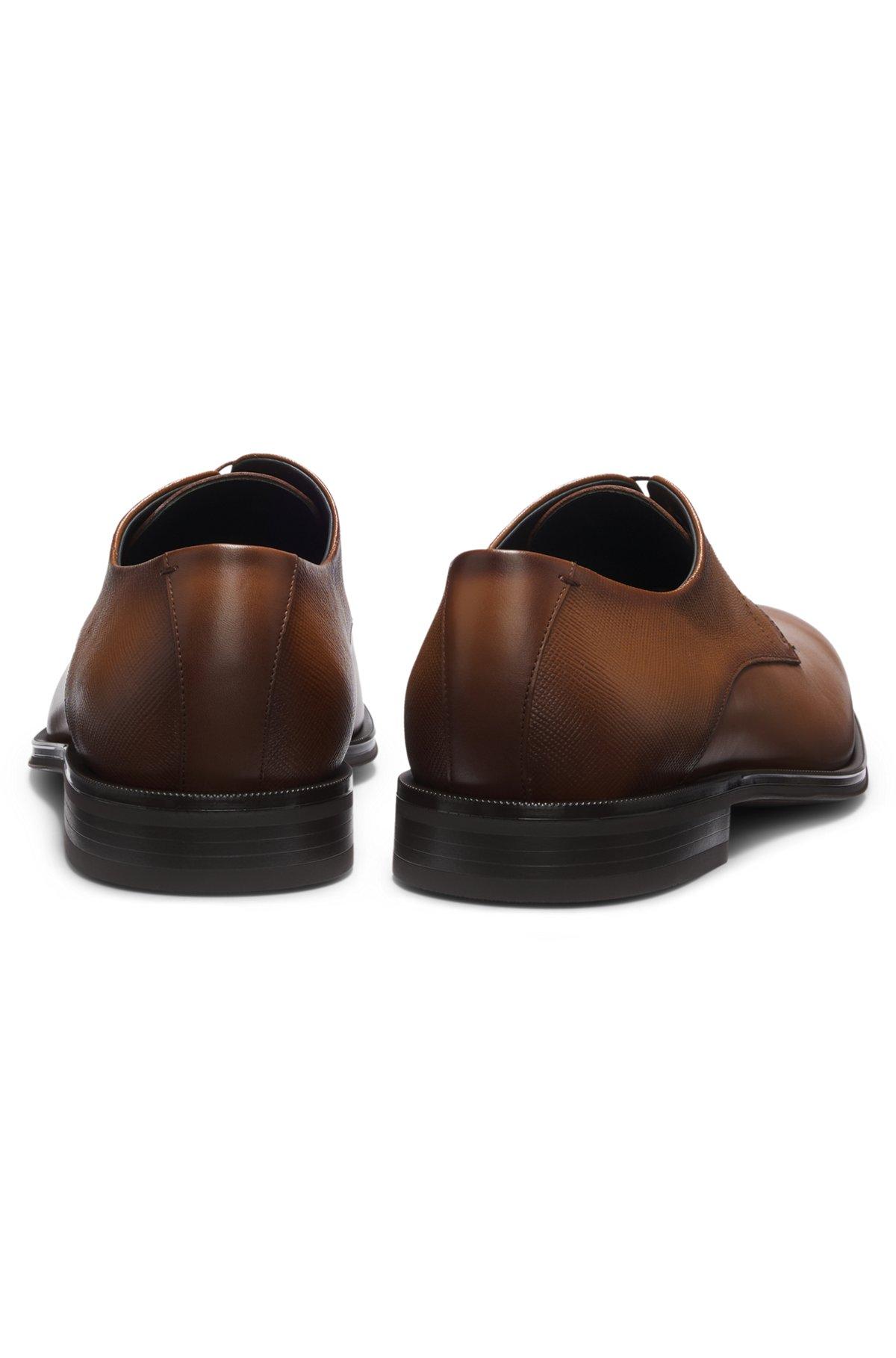Derby shoes in textured and smooth leather Product Image