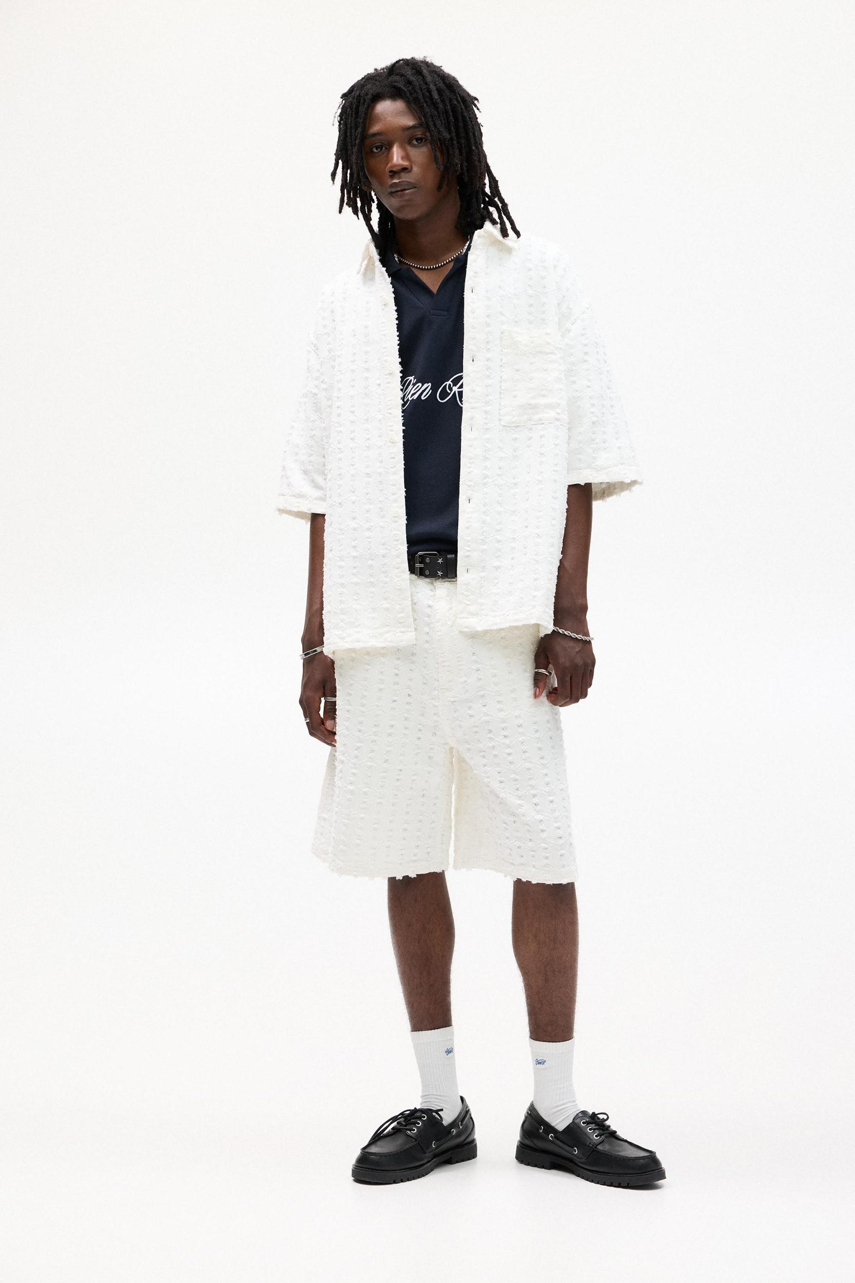 Textured baggy denim Bermuda shorts Product Image