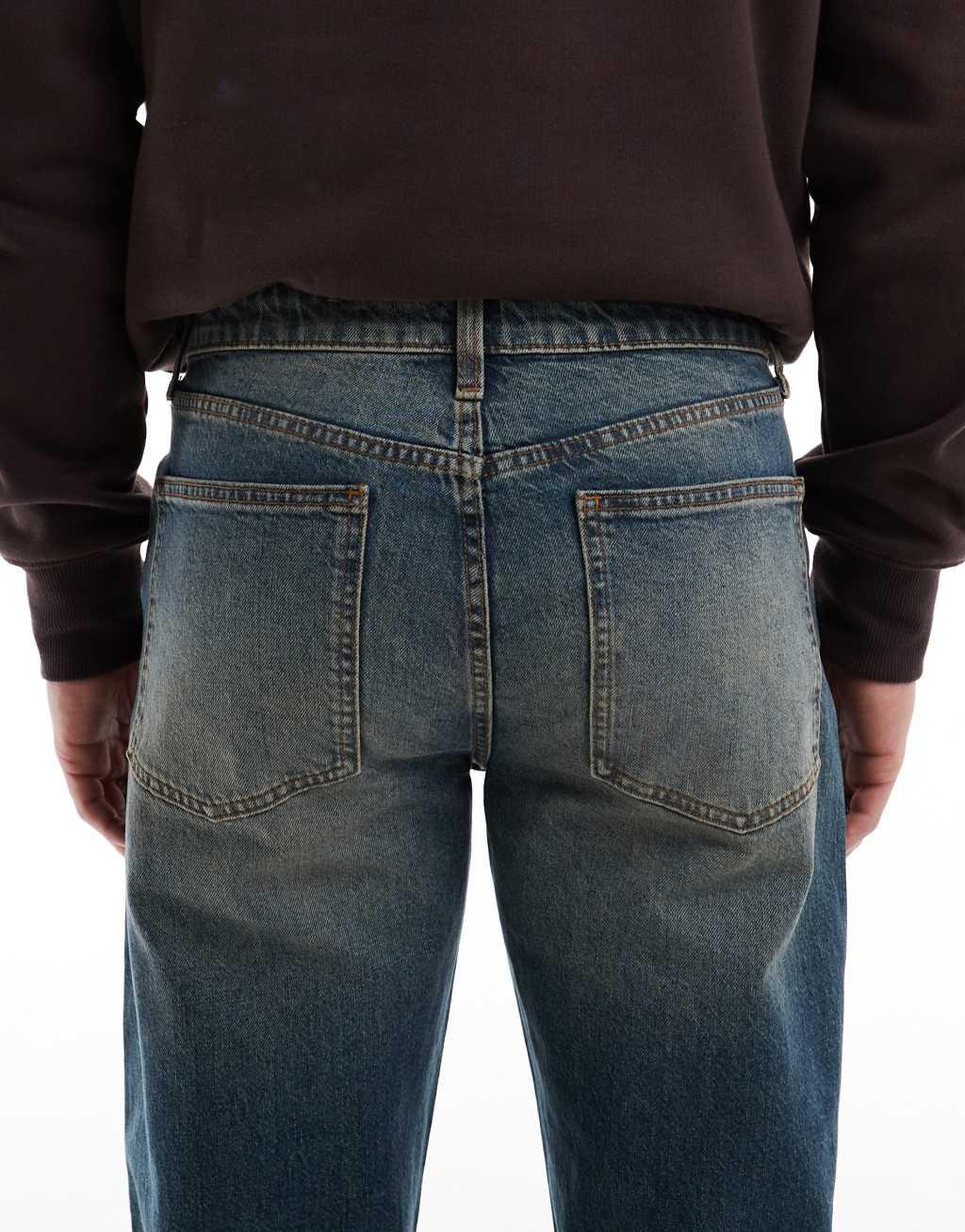 ASOS DESIGN straight leg stretch jeans with tint in dark wash blue Product Image