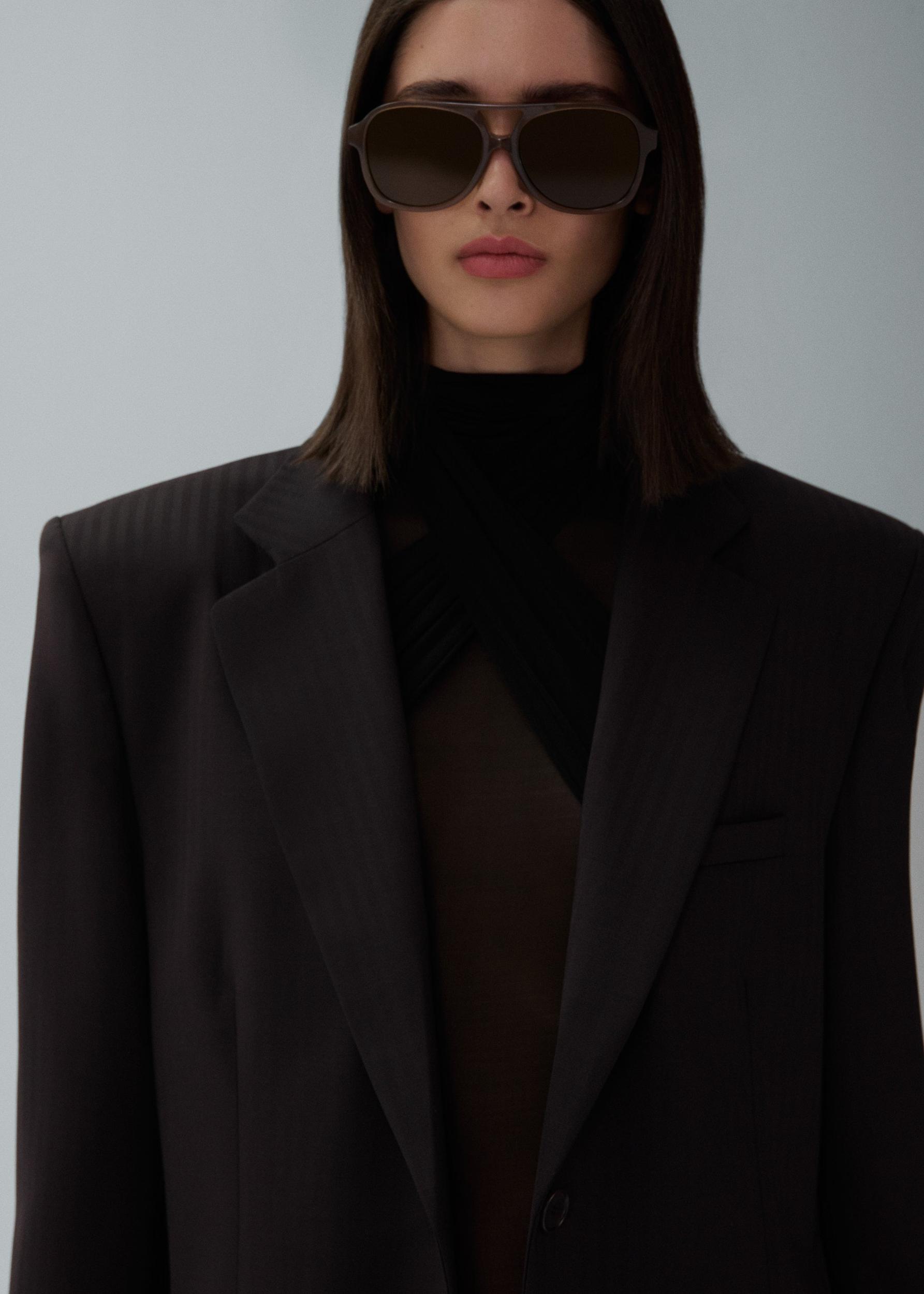 Sheer high neck bodysuit in black Product Image