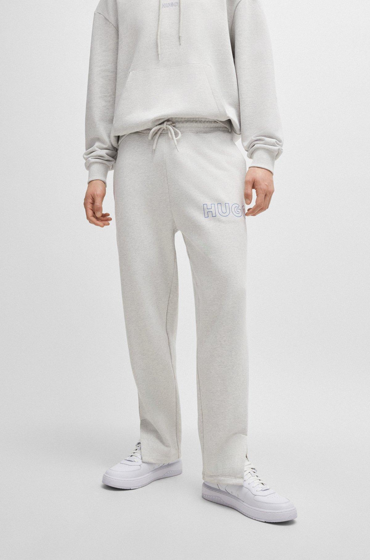 Loose-fit cotton-terry tracksuit bottoms with outline logo Product Image