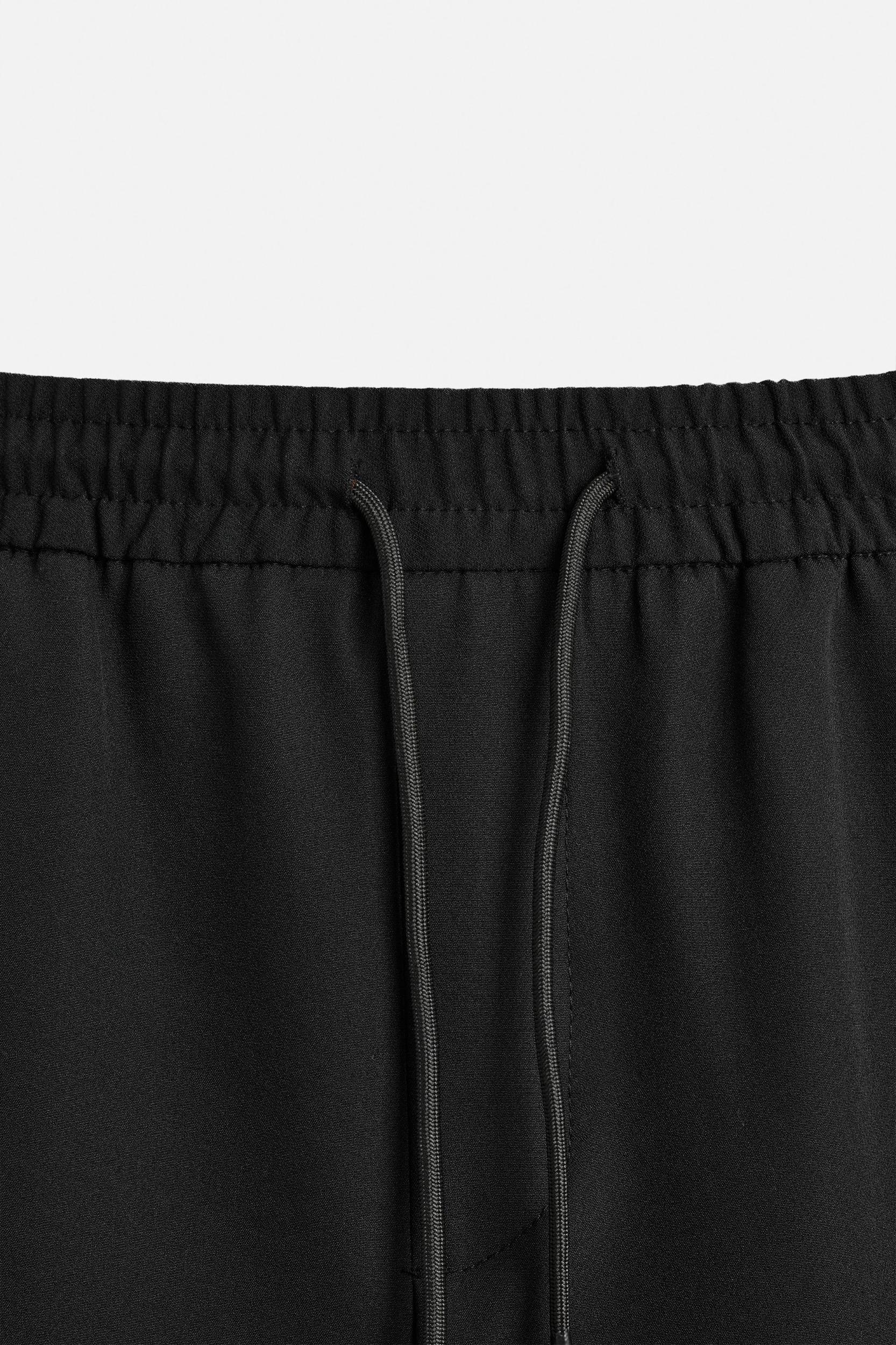 RELAXED FIT PANTS WITH CONTRASTING STRIPES Product Image