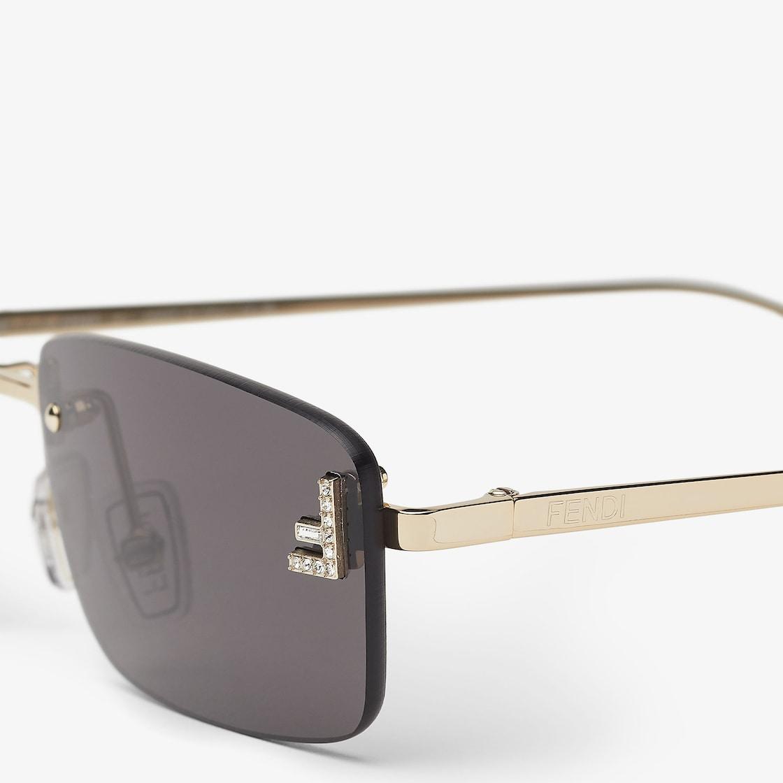 Fendi First CrystalGold-colored sunglasses with gray lenses Product Image