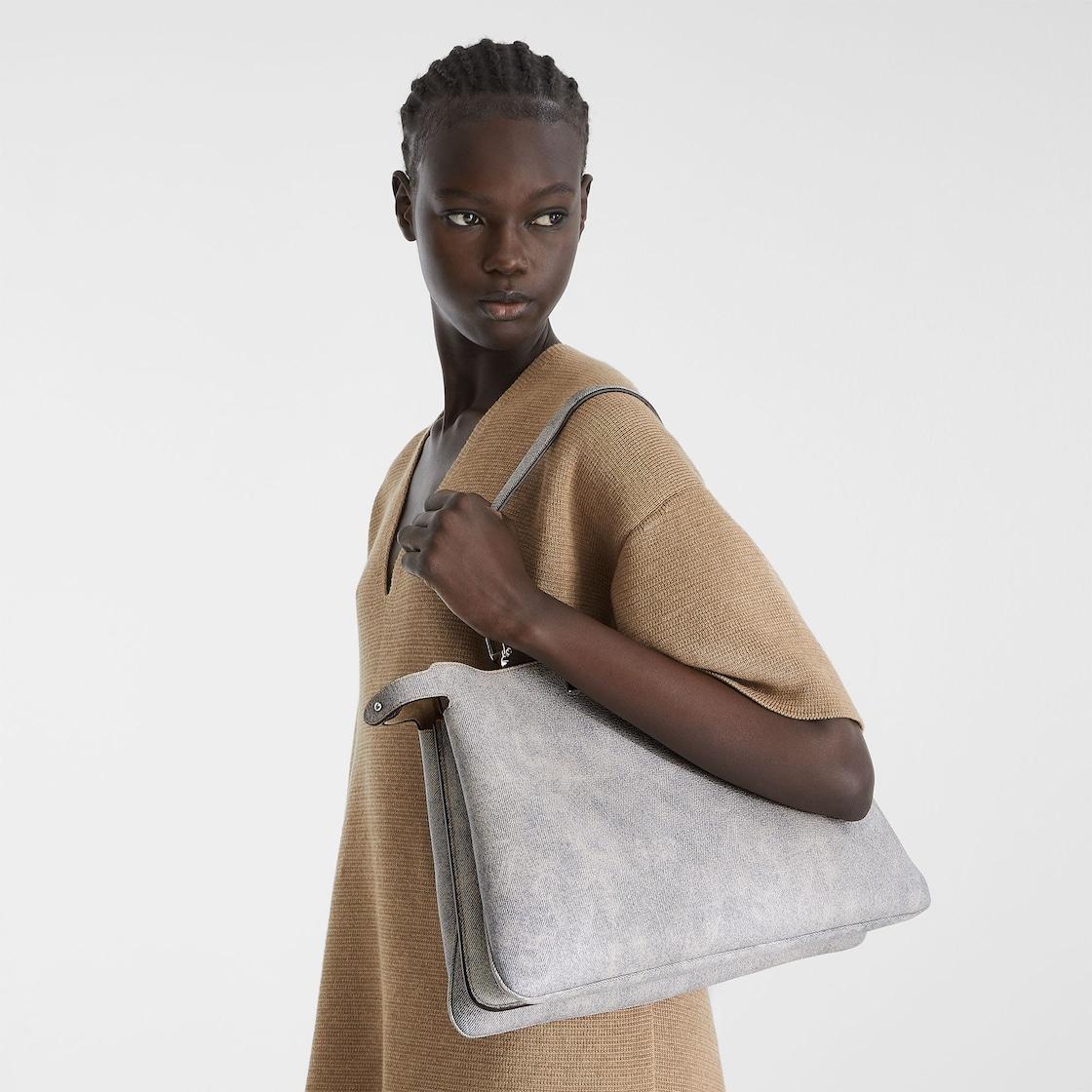 Peekaboo Soft LargeGray leather bag with a faded denim effect. Product Image