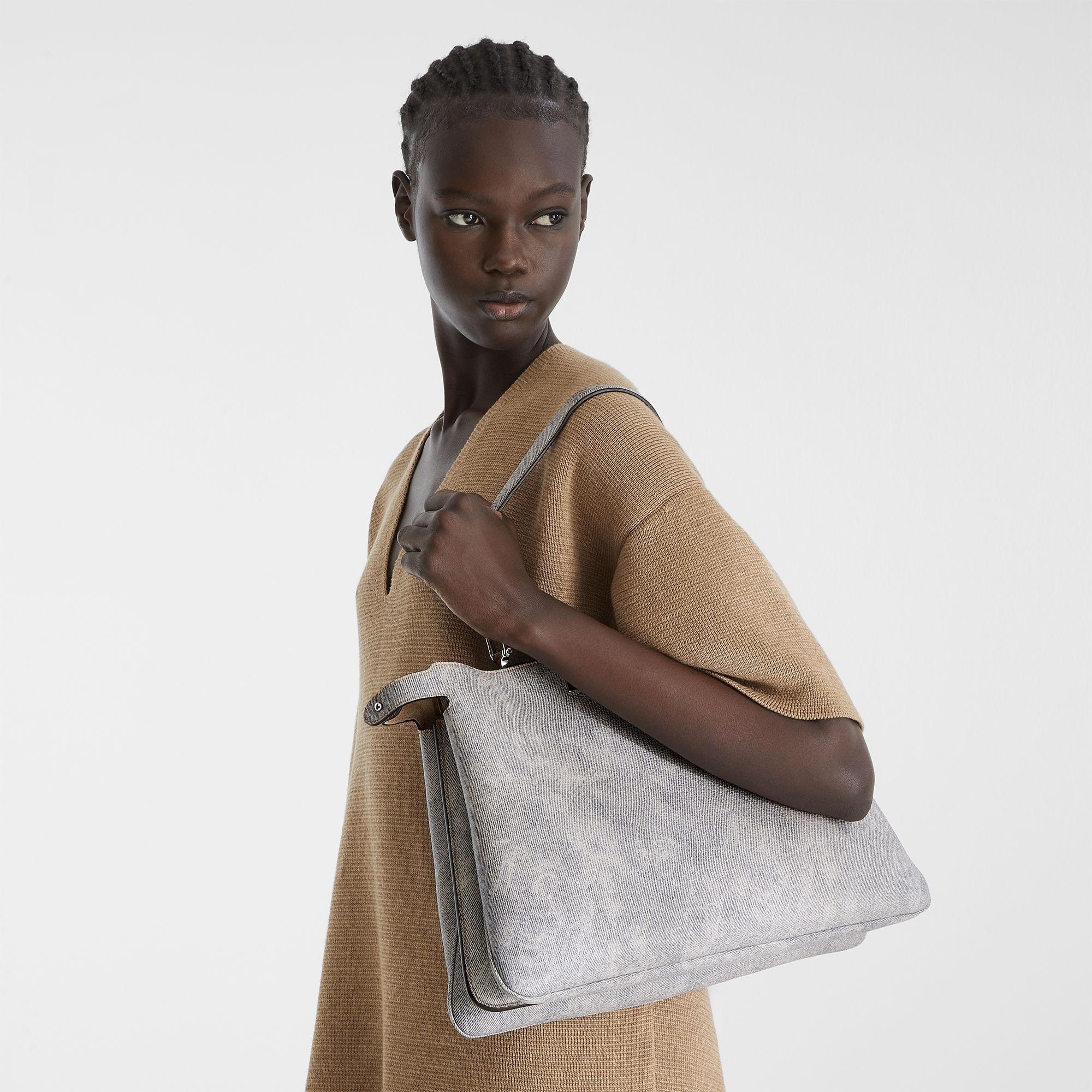 Peekaboo Soft LargeGray leather bag with a faded denim effect. Product Image