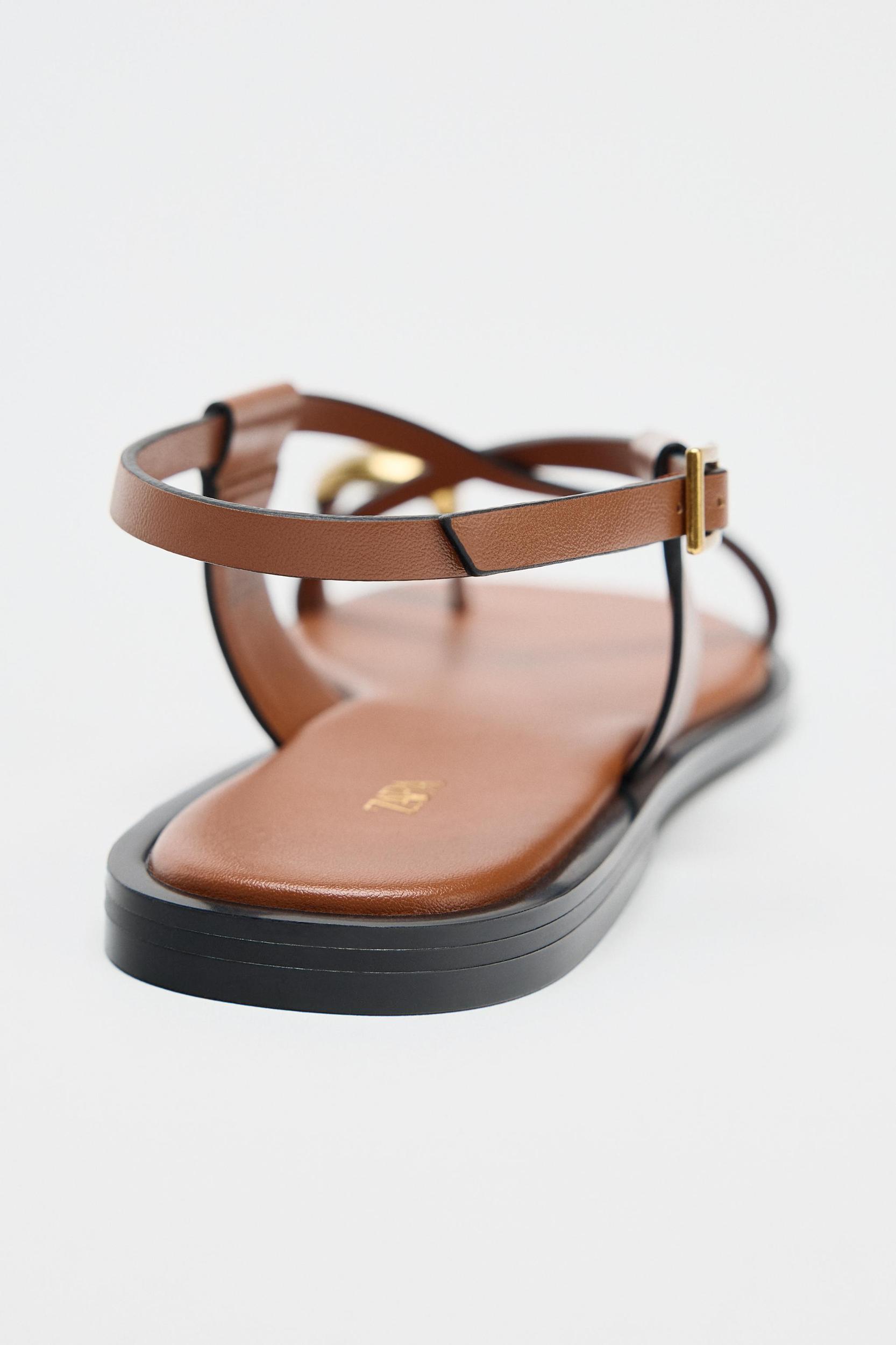 FLAT SANDALS WITH STRAPS AND METAL DETAIL Product Image