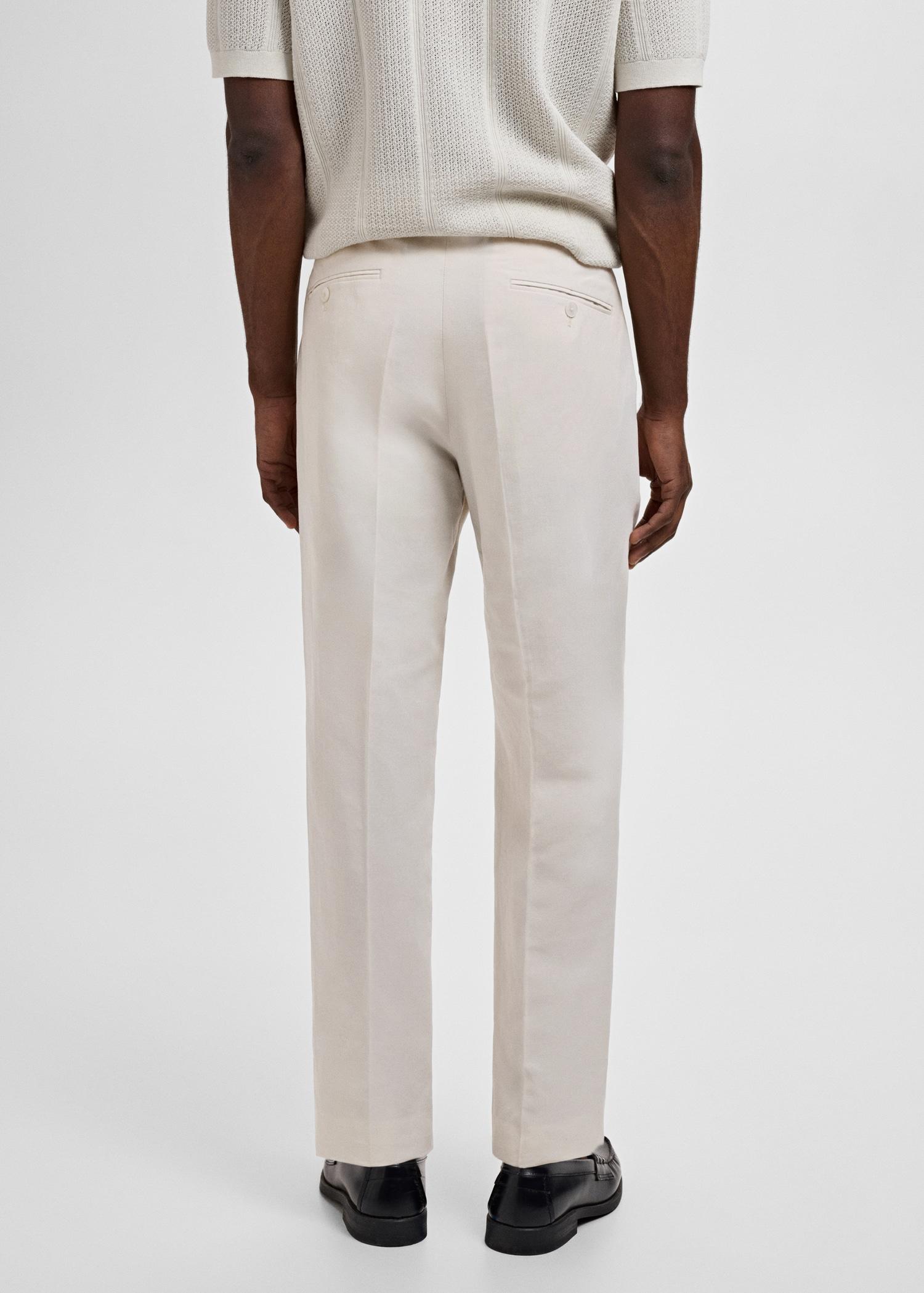 Slim-fit pleated linen pants - Men | MANGO USA Product Image