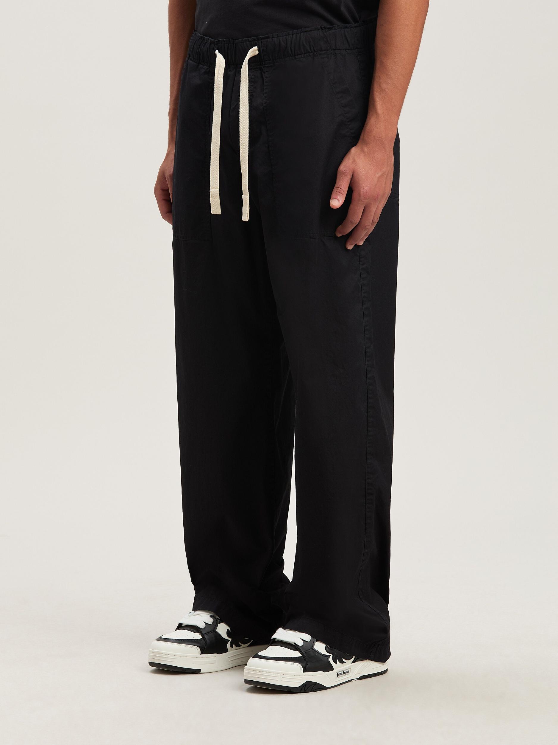 CURVED LOGO LOOSE PANTS Product Image
