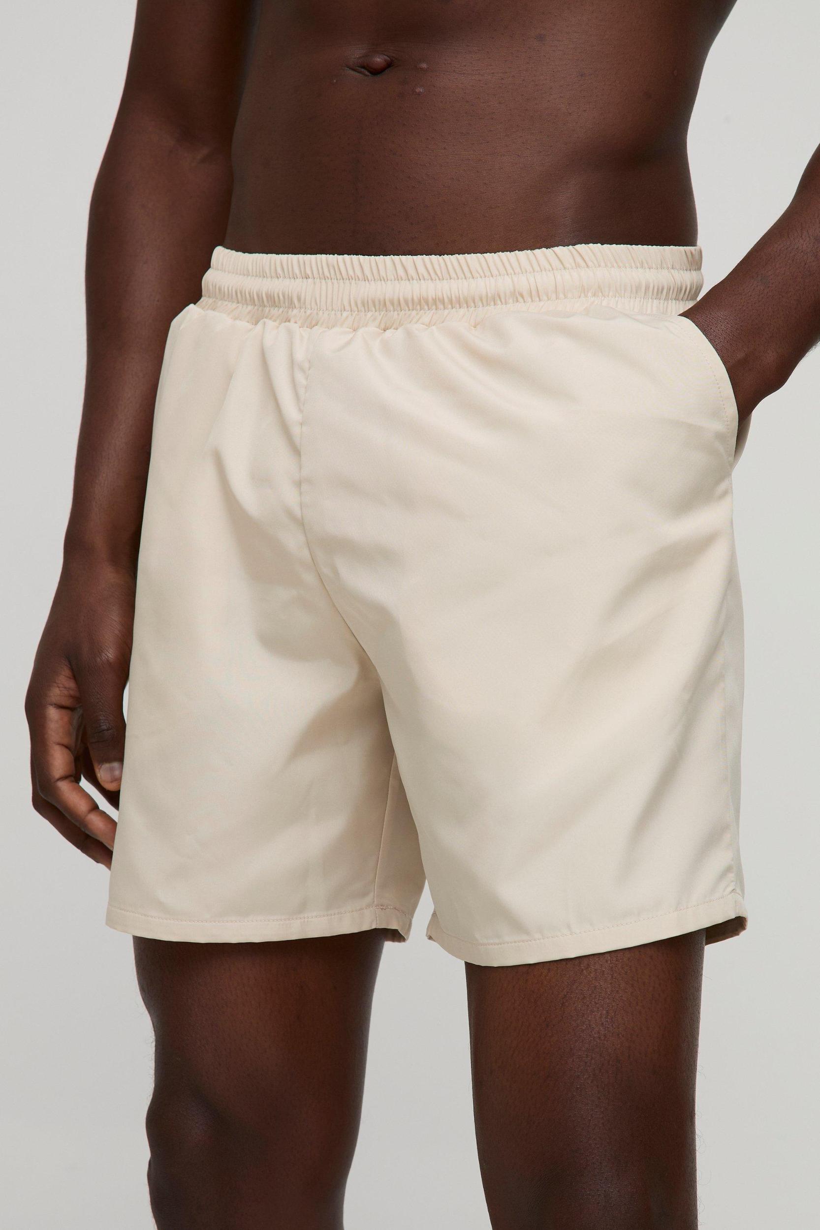Regular fit Mid length Plain Swim Shorts | boohooMAN USA Product Image