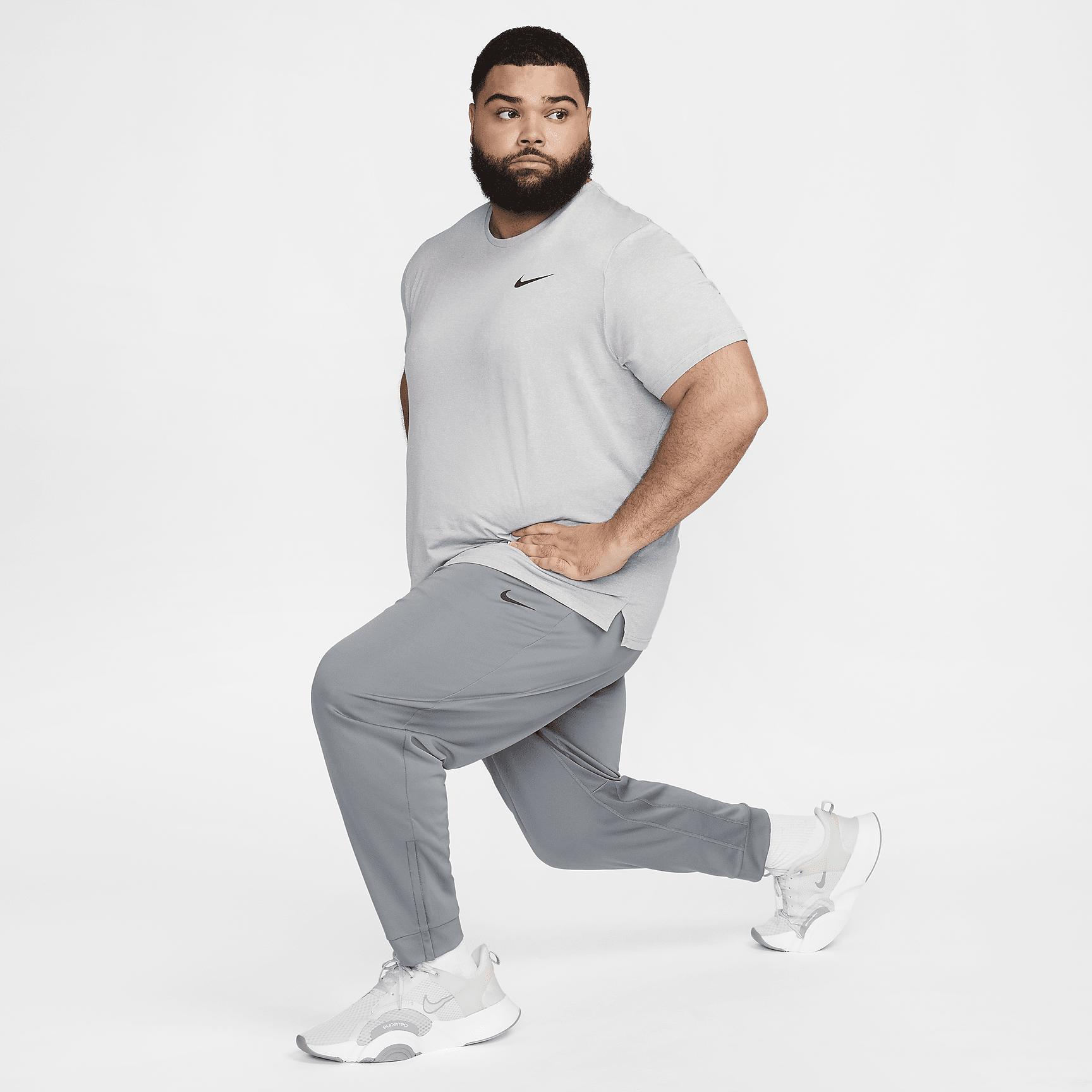 Nike Mens Totality Dri-FIT Tapered Versatile Pants | FB7509-084 Product Image
