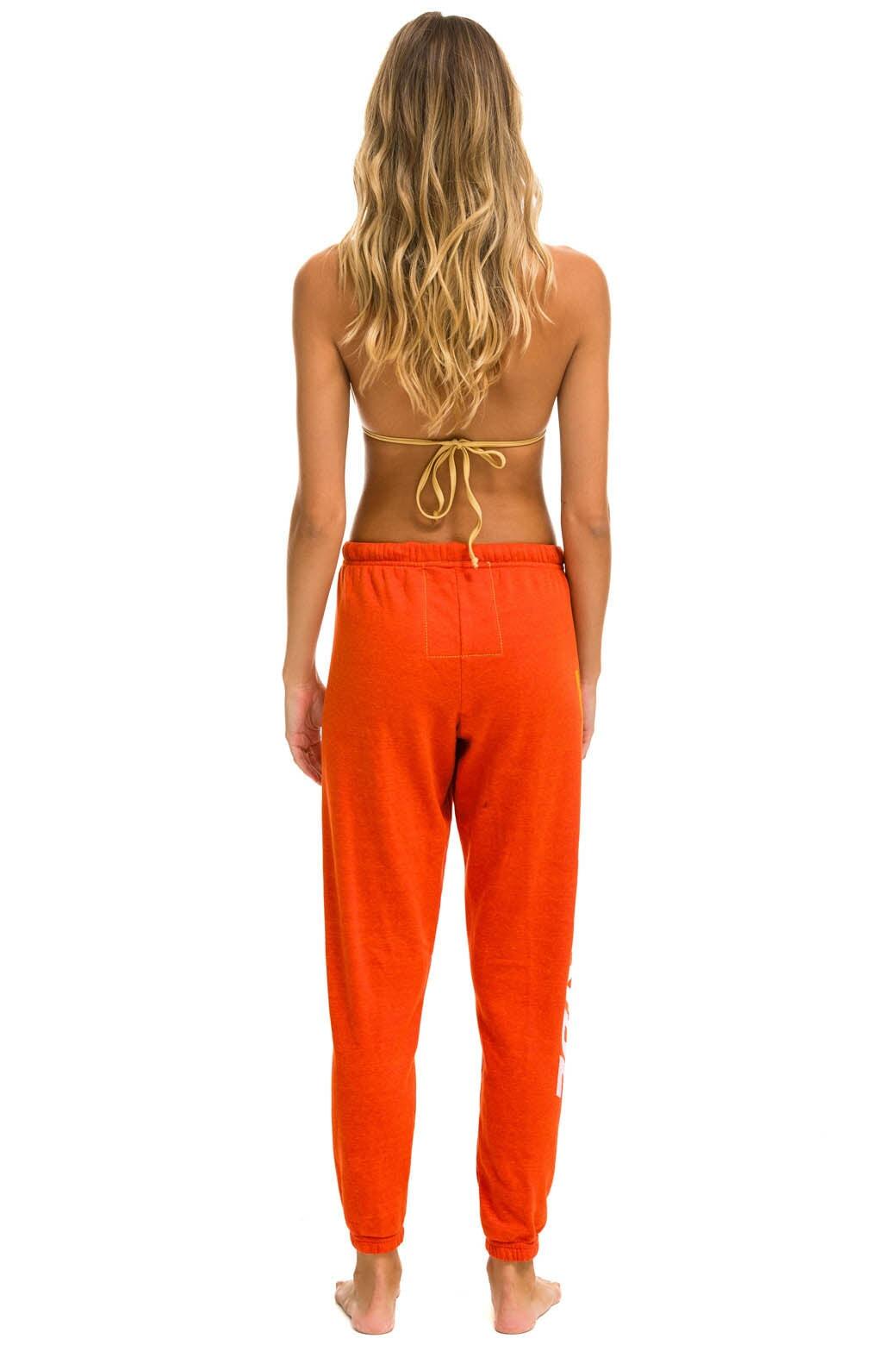 RIDE LOGO WHITE SWEATPANTS - ORANGE Female Product Image