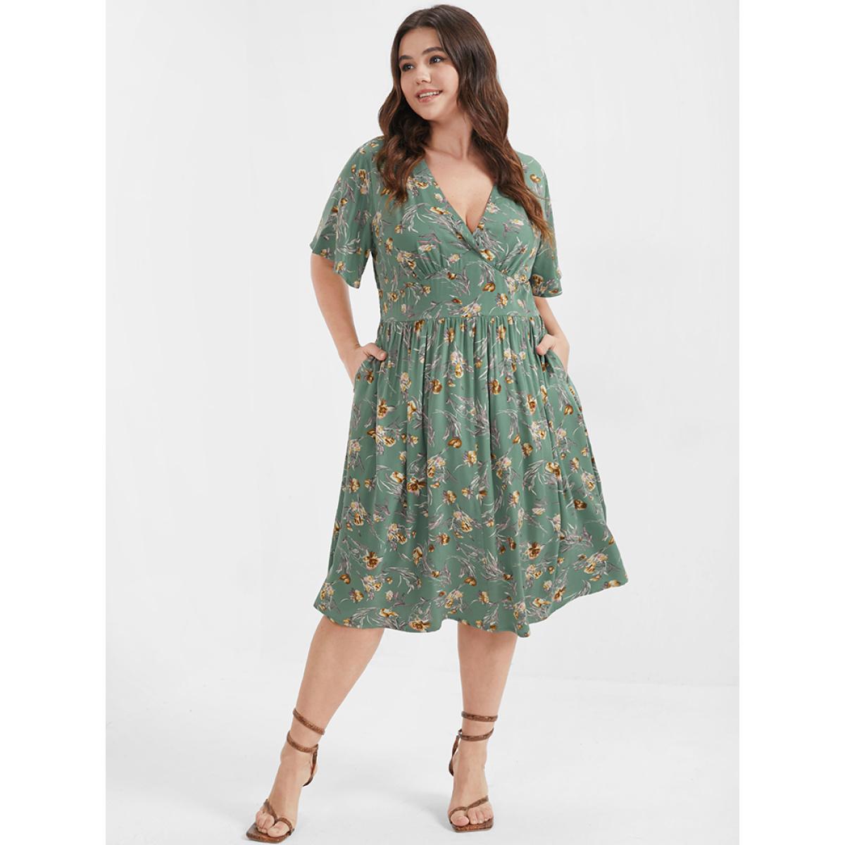 Plus Size Bloom Dress - Floral Flutter Shirred Pocket V Neck Dress Green Women Casual Gathered V-neck Short sleeve Curvy Midi Dress BloomChic 14-16/1X Product Image