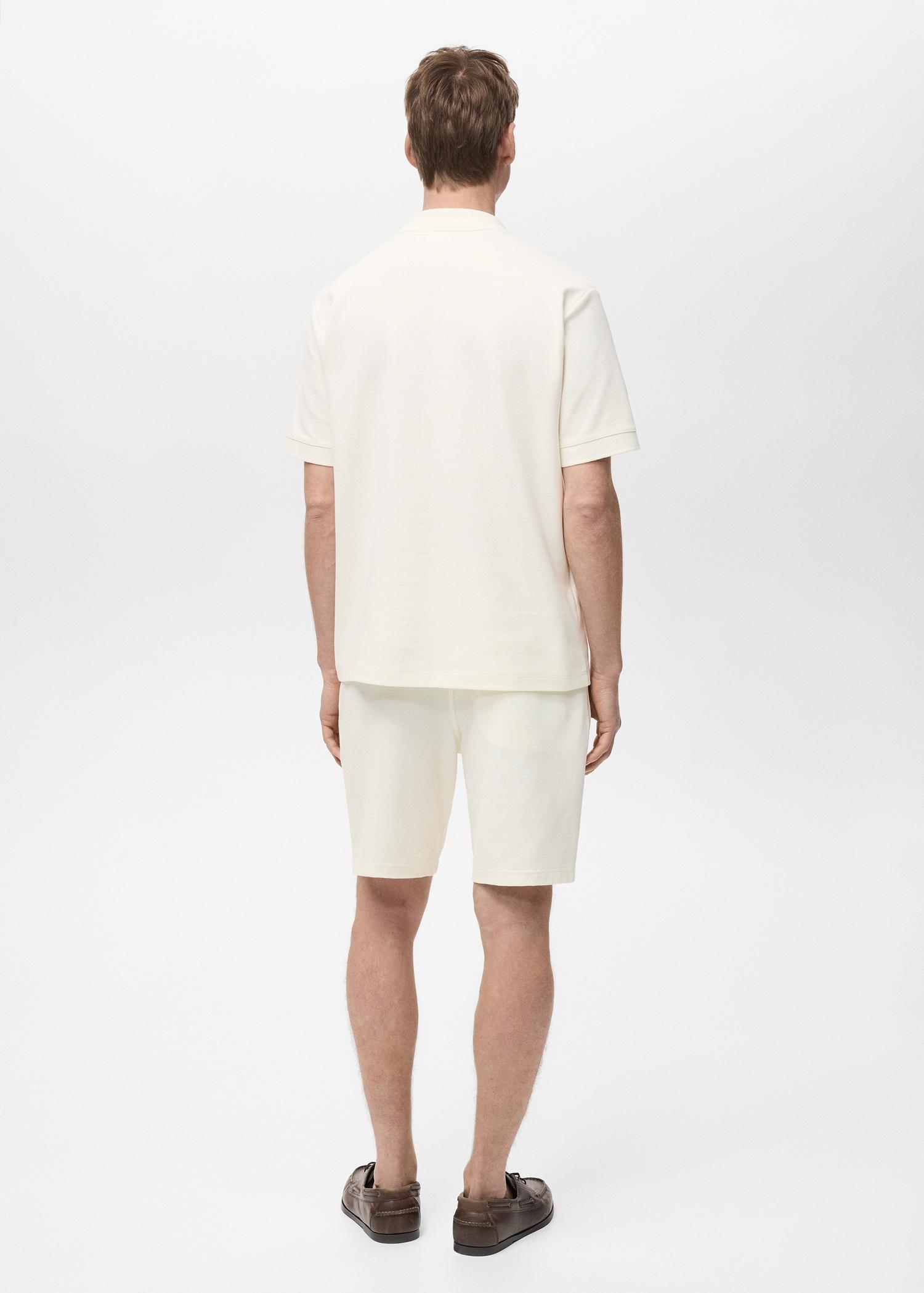 Structured knitted polo shirt - Men | MANGO USA Product Image