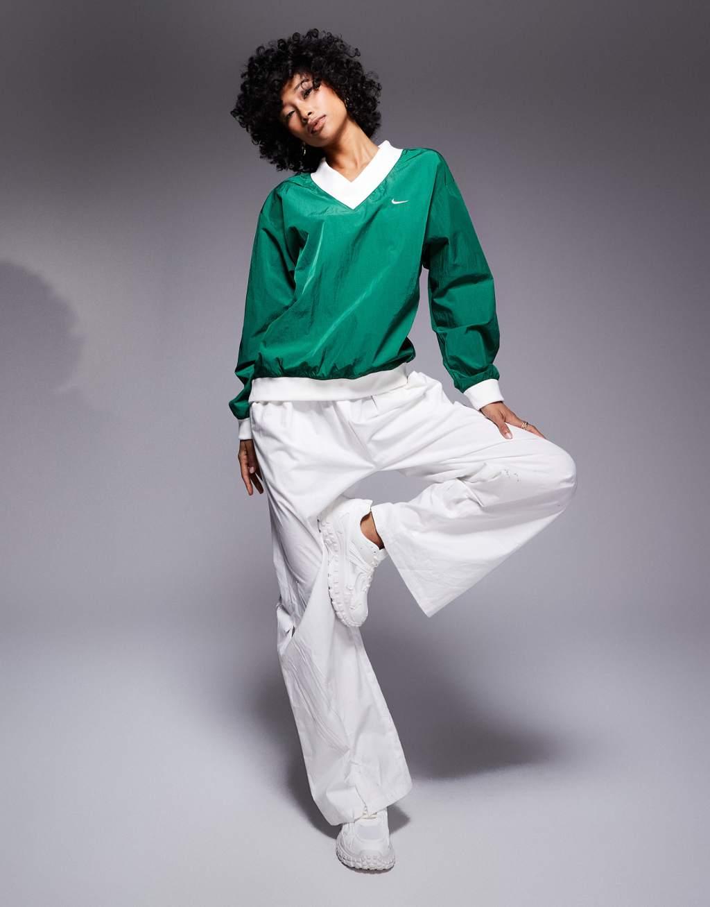 Nike Essential woven long sleeve v neck sweater in green Product Image