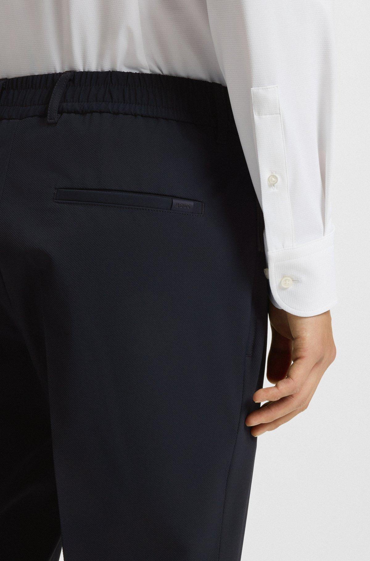 BOSS - Packable slim-fit trousers in performance-stretch fabric - Dark Blue Product Image