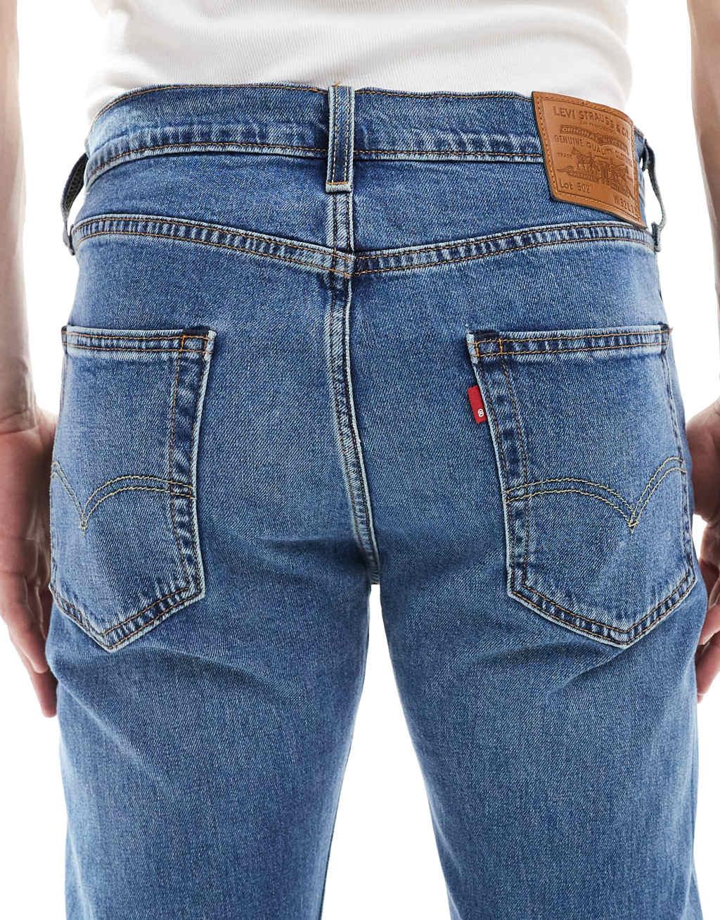 Levi's 502 tapered fit jeans in mid wash Product Image