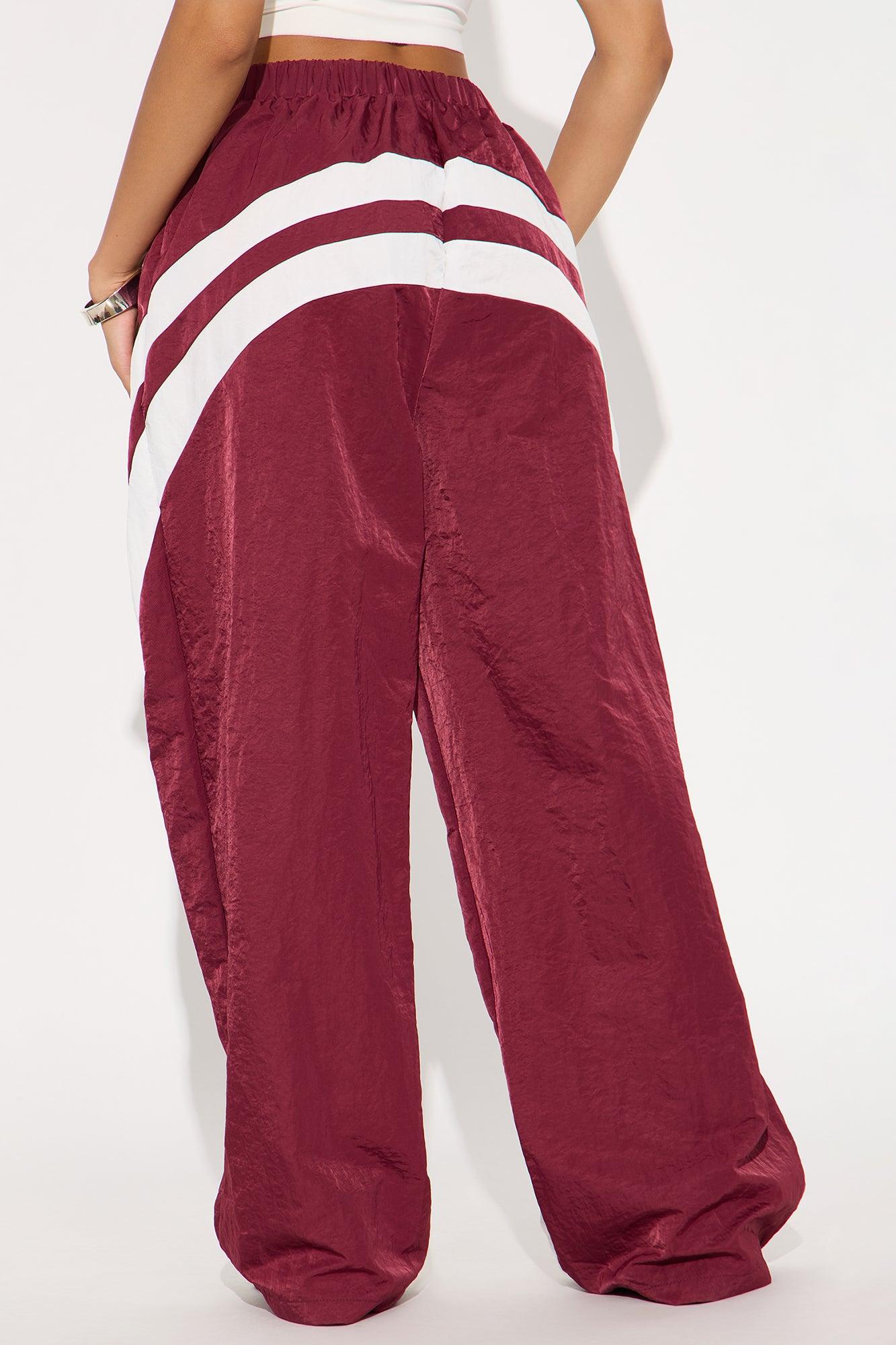 Follow The Curve Windbreaker Track Pant - Burgundy Female Product Image