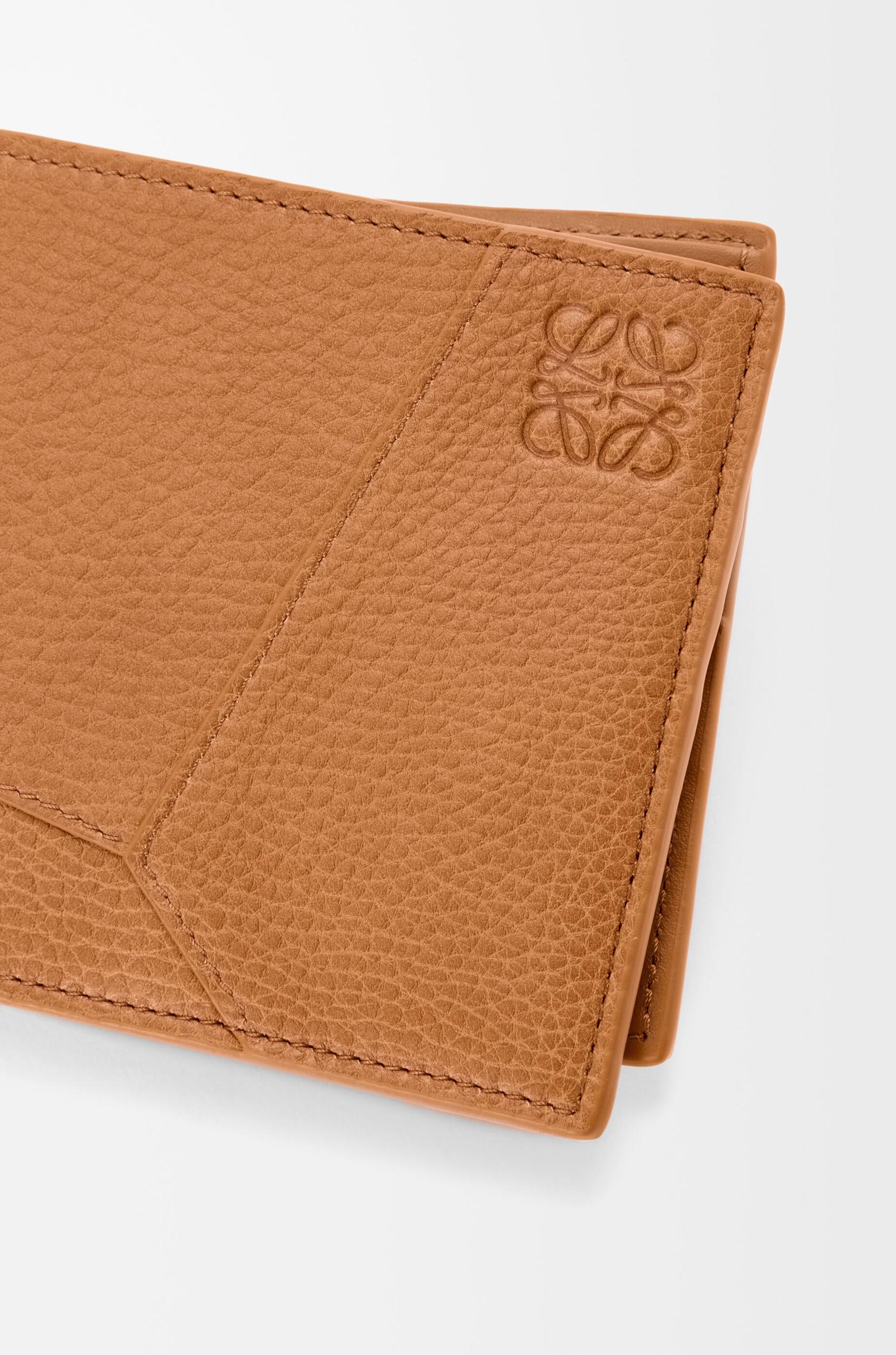 Puzzle bifold wallet in supple grained calfskin Product Image