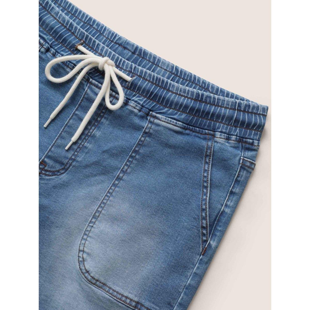Plus Size Medium Wash Drawstring Roll Hem Denim Shorts Women Midblue Roll Hem High stretch Everyday Slanted pocket Casual Denim Shorts BloomChic 12/L Product Image