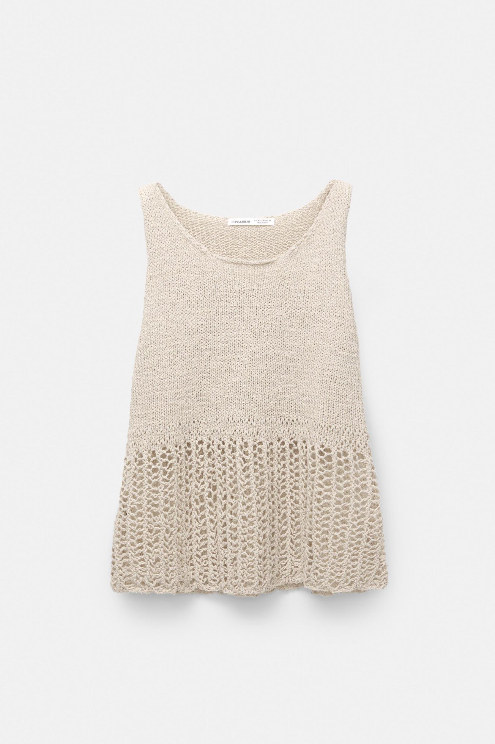 Knit top with an open knit hem Product Image