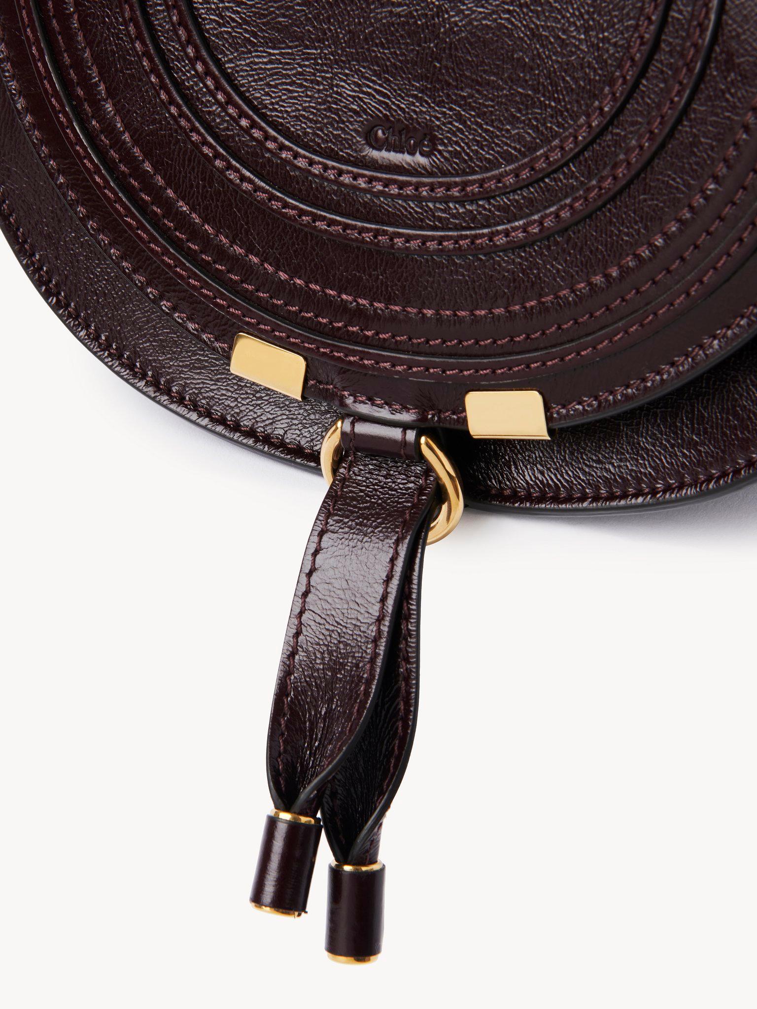 Small Marcie saddle bag in shiny leather Product Image