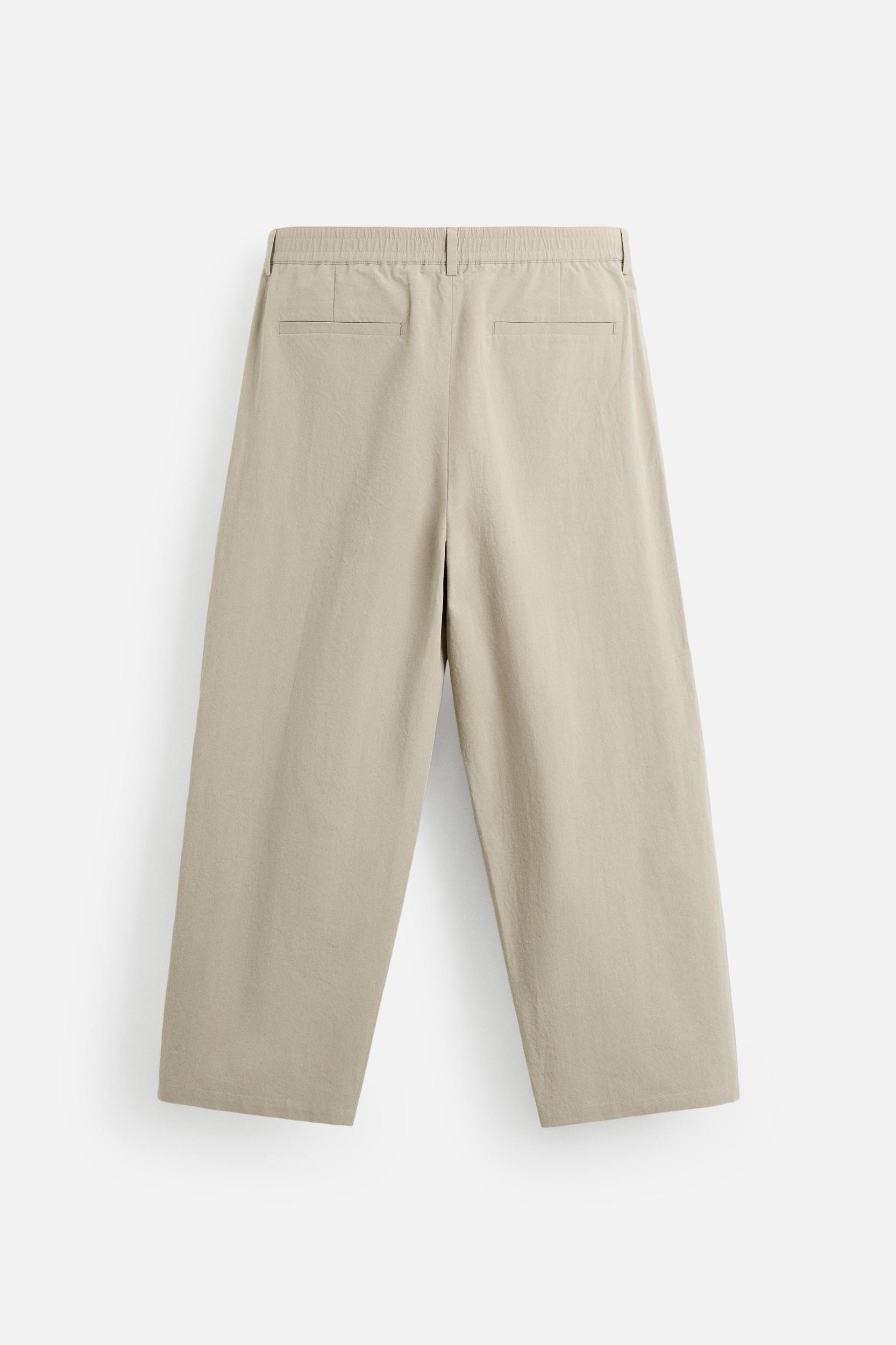 PLEATED CHINO PANTS Product Image