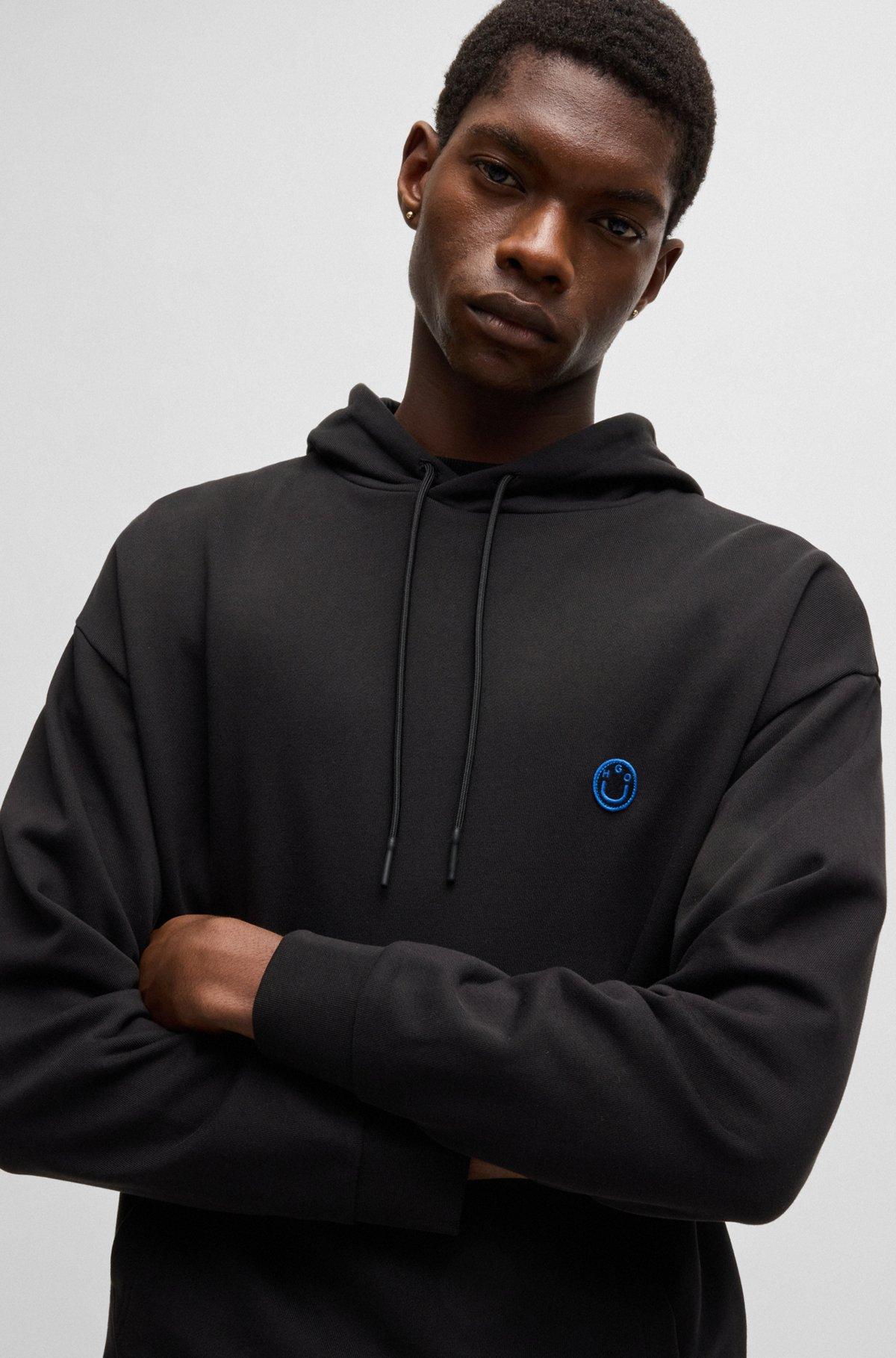 Cotton-terry hoodie with Happy HUGO logo Product Image