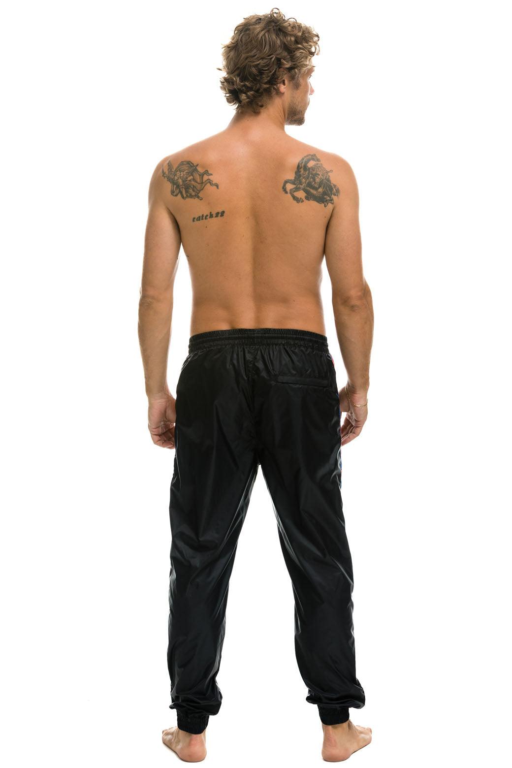 MEN'S 4 STRIPE WIND PANT - BLACK Male Product Image