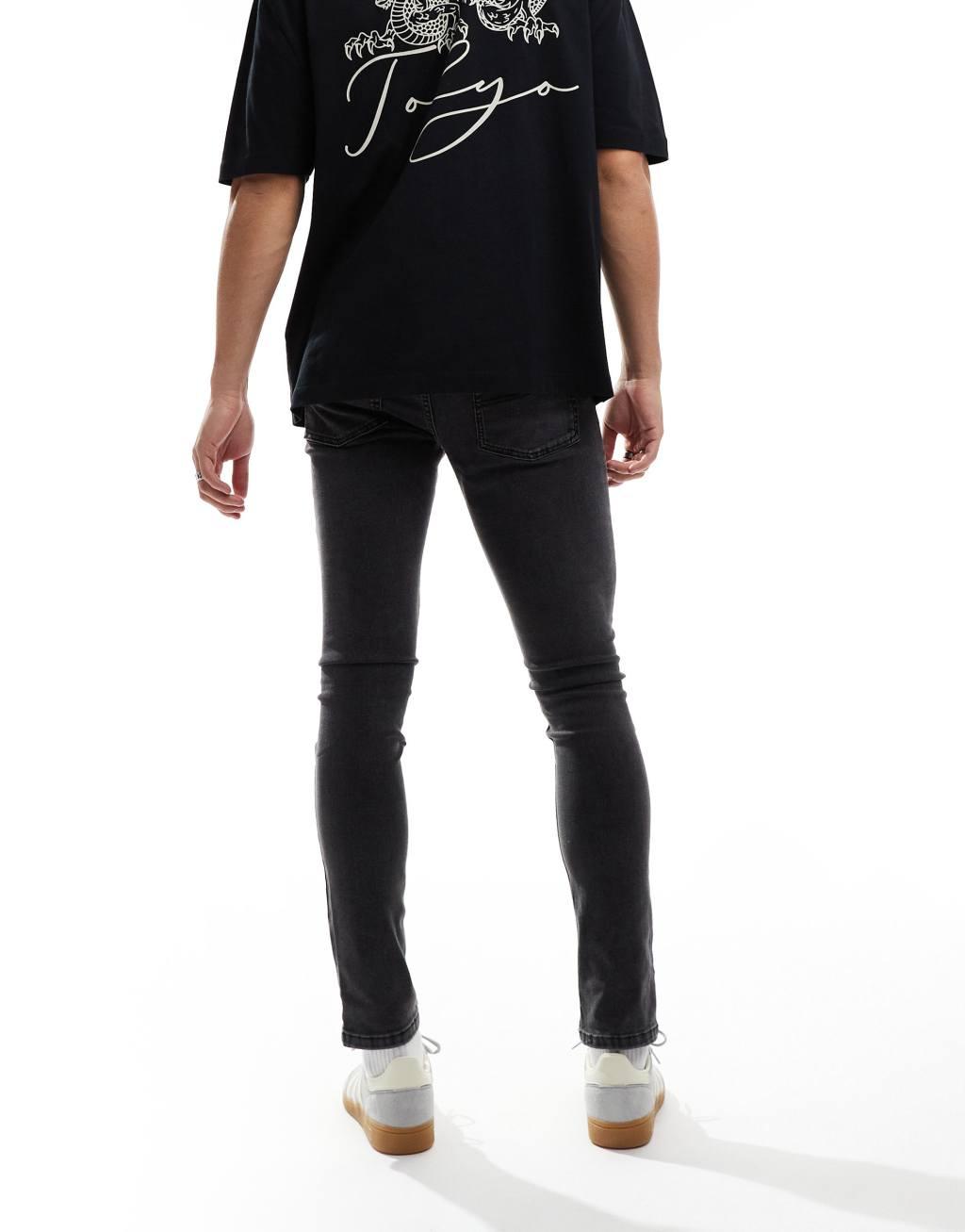 COLLUSION mid rise skinny jeans in washed black Product Image