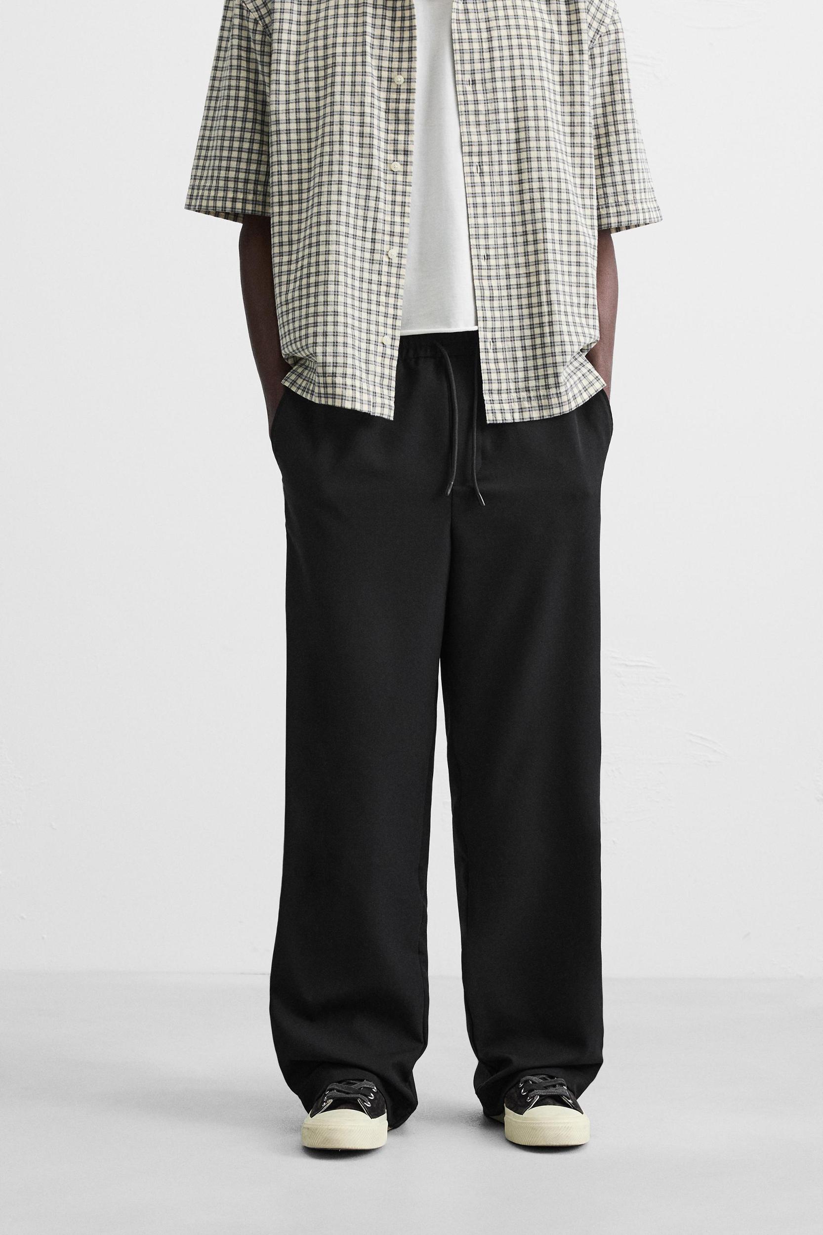 RELAXED FIT PANTS WITH CONTRASTING STRIPES Product Image
