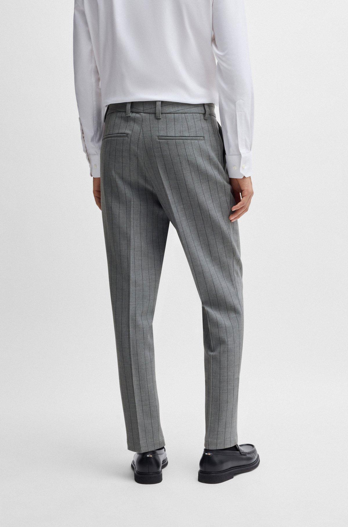Tapered-fit trousers in pinstripe stretch fabric Product Image
